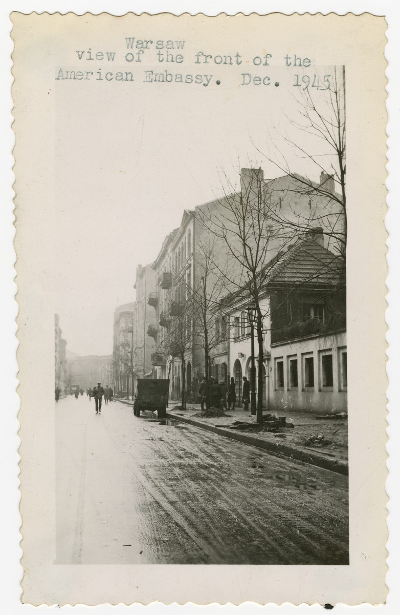 Street scene in postwar Warsaw in front of the American Embassy.