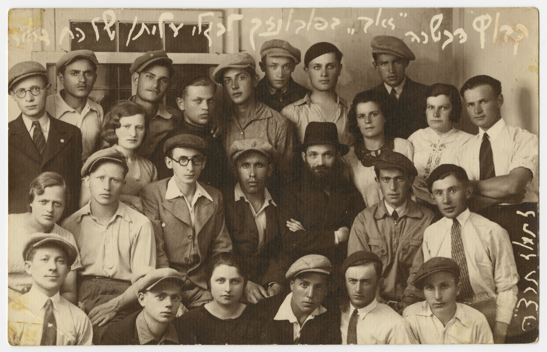 Asher Fetherhar (later Zidon) poses with members of the Hechalutz Mizrachi hachshara probably in Powazki.