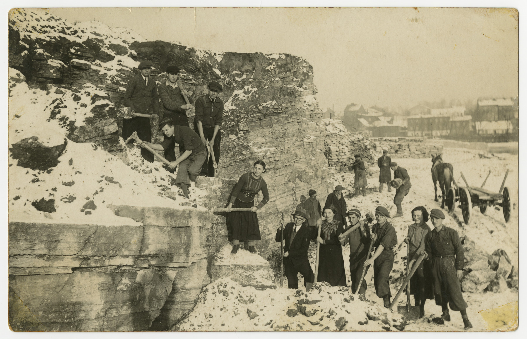Asher Fetherhar (later Zidon) poses with members of the Hechalutz Mizrachi hachshara in Czeladz while working in a quarry.