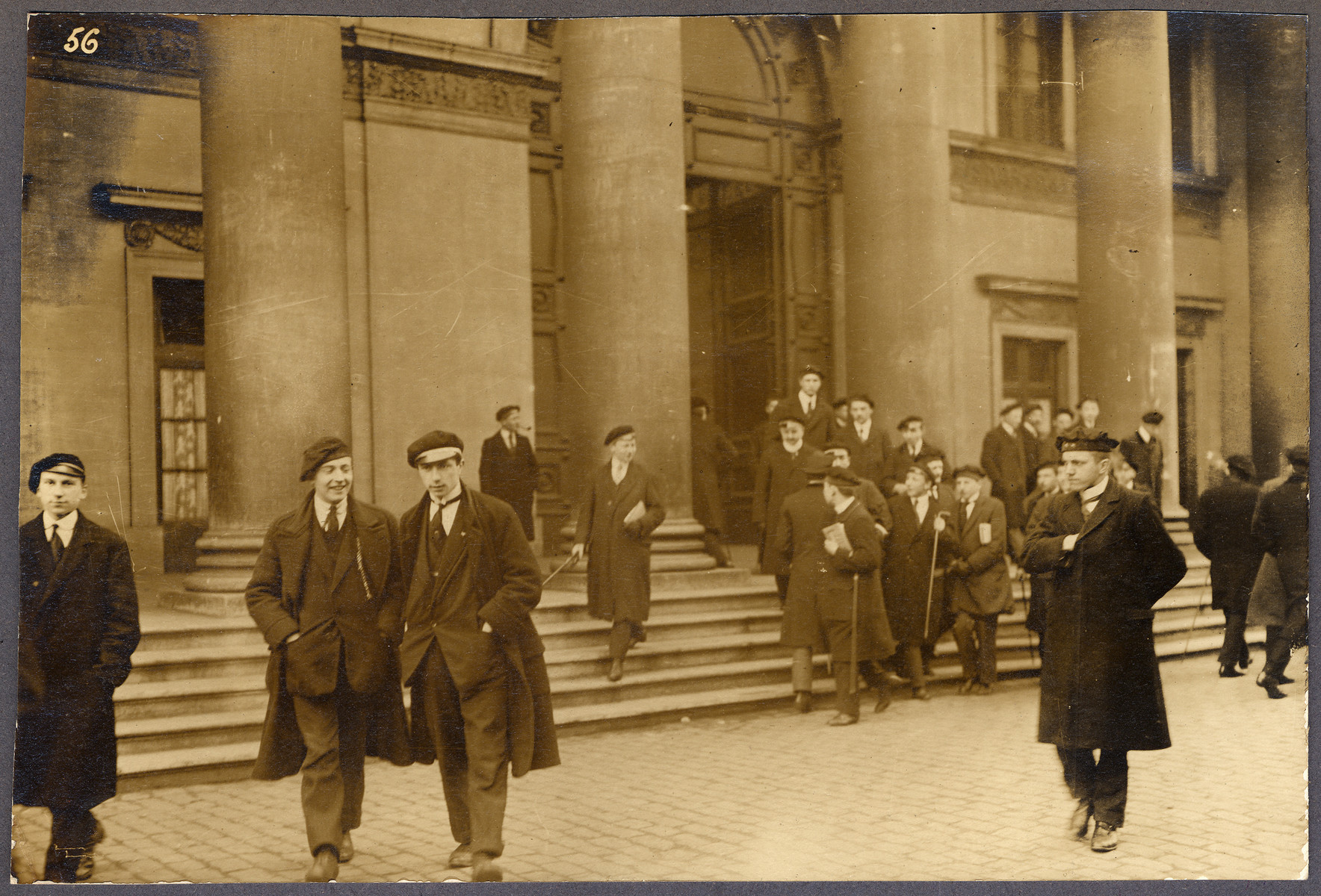 Students stand before the Aula building at Von Bissing University, founded during the German occupation of Belgium in WWI.