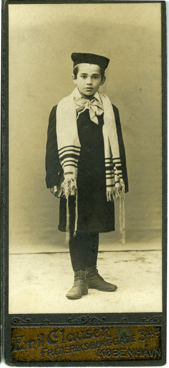 Bar mitzvah portrait of a Jewish boy in Denmark wearing a tallit; the child is a cousin of Bente Jonas.