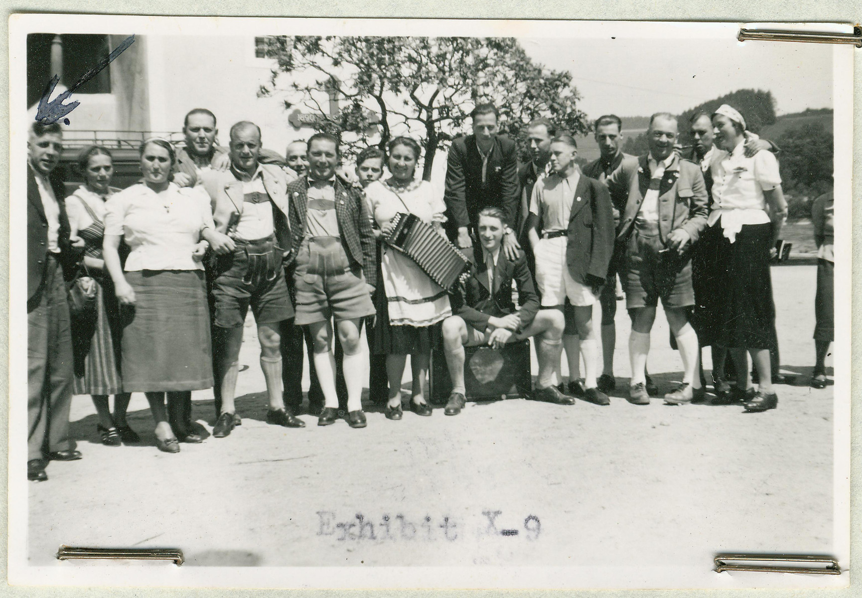 Group portrait of the staff of the Hartheim euthanasia facility relaxing with an accordion.