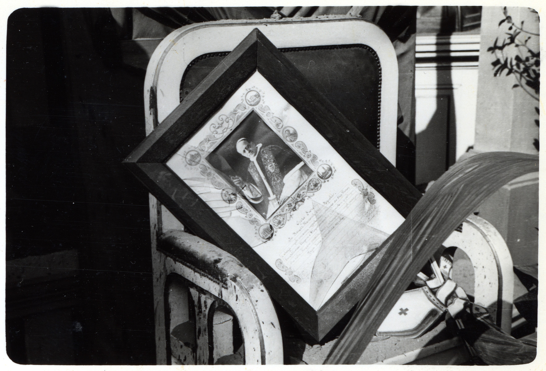 A portrait of Pope Pius XI is saved from a destroyed church in besieged Warsaw.