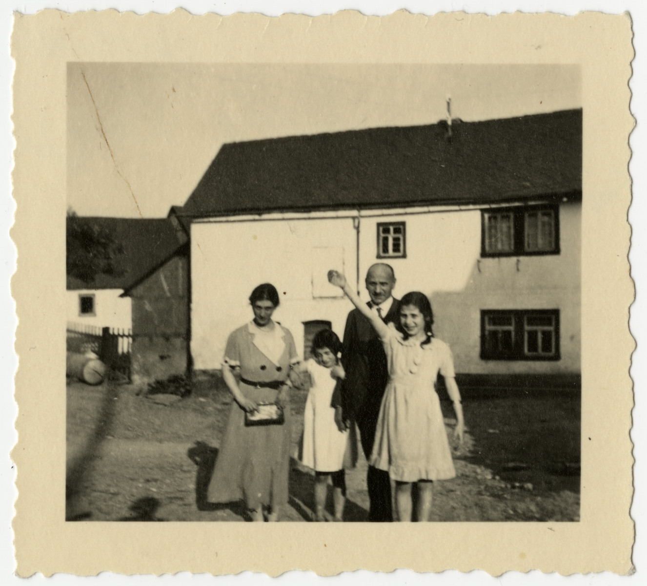 The Loeb family stands outside a warehouse in Halsenbach, Germany.

From left to right are Caroline, Hildegarde, Rudolf and Clare Loeb.