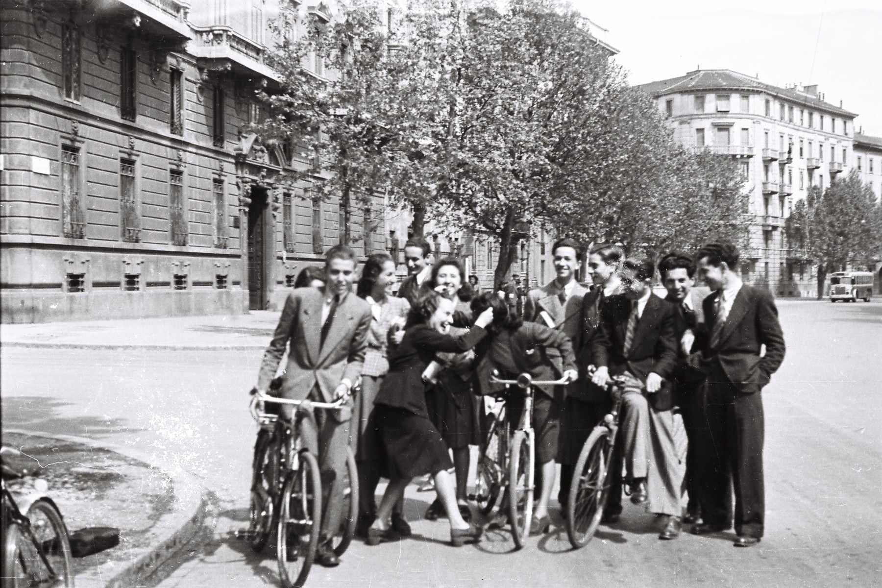 Students from the Scuolo via Eupili ride their bikes down the Via Canova while on a school trip.