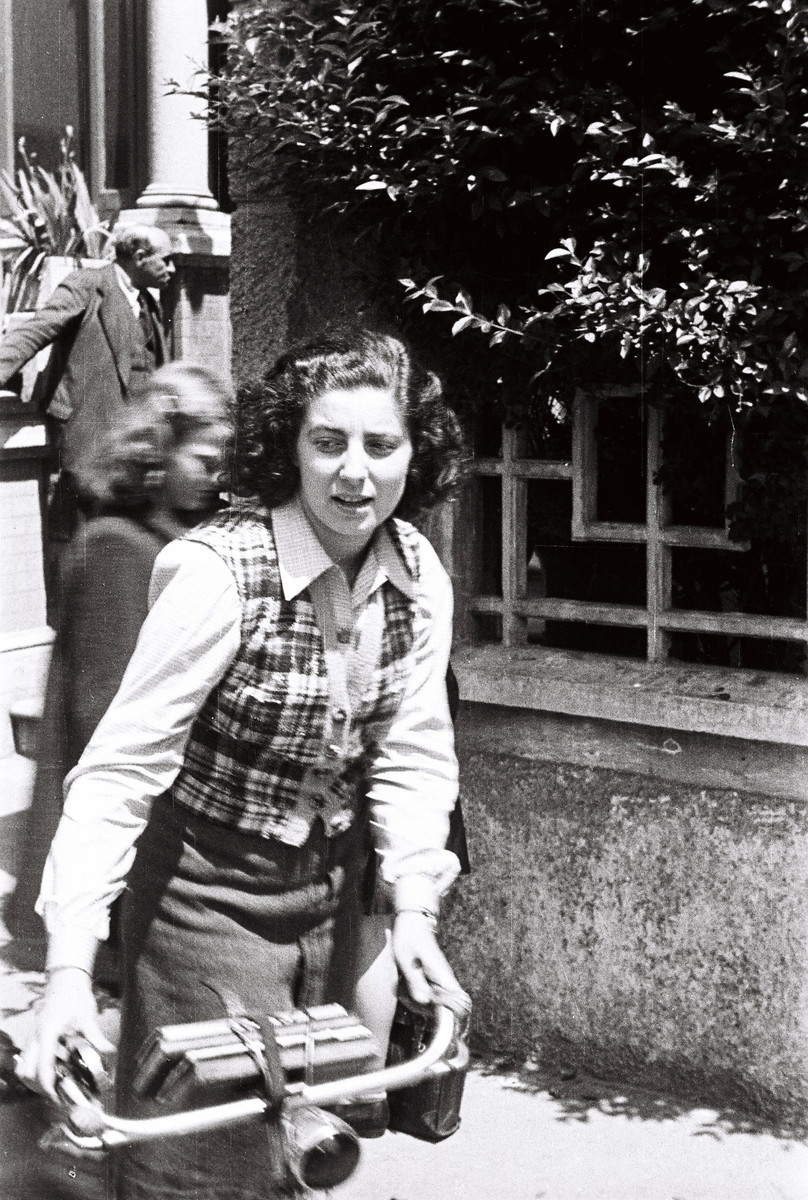 Nora Heinebach, a student at the Jewish school in Milan, rides her bicycle.