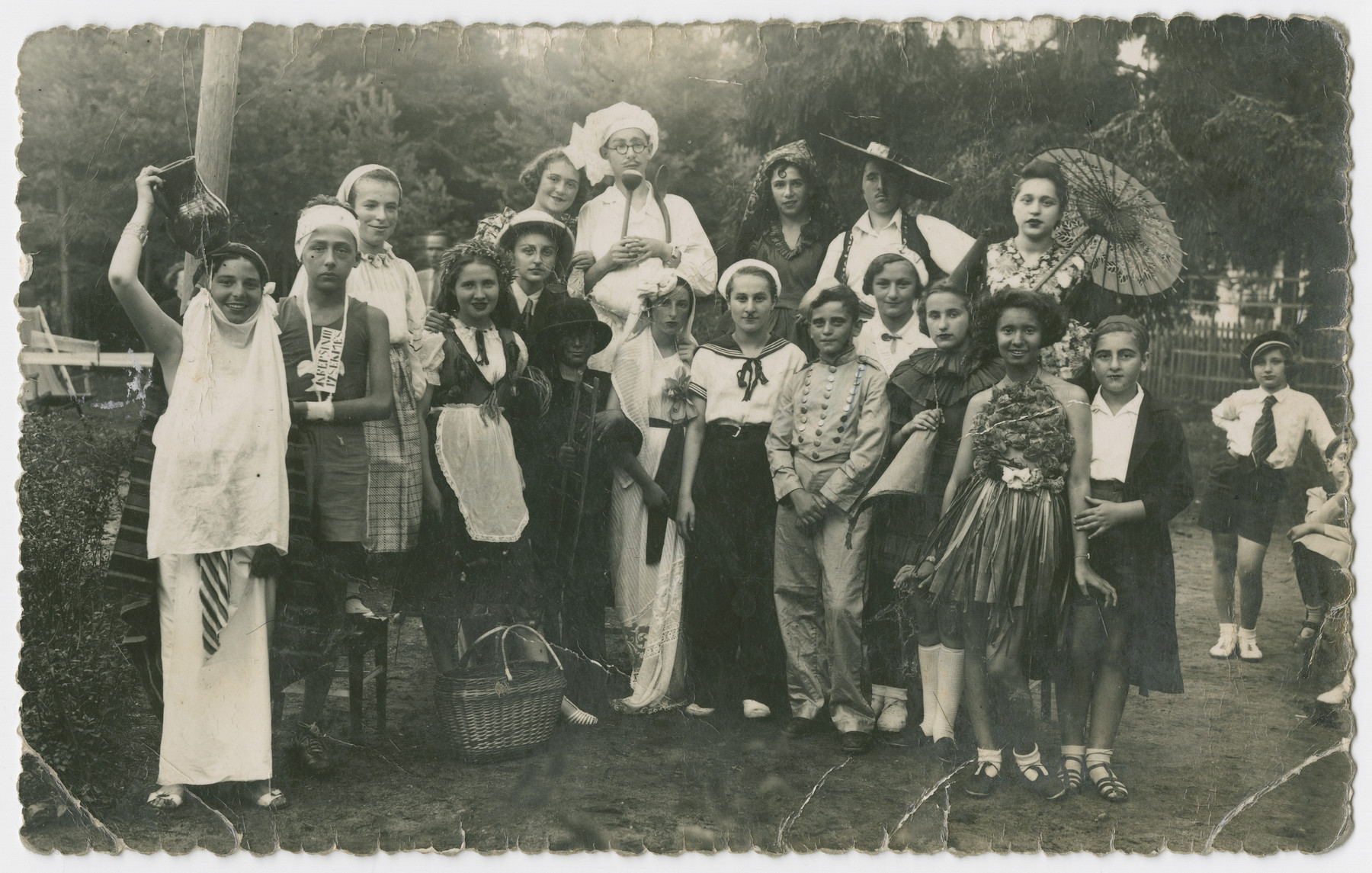 A group of teenagers dressed in [Purim] costumes.