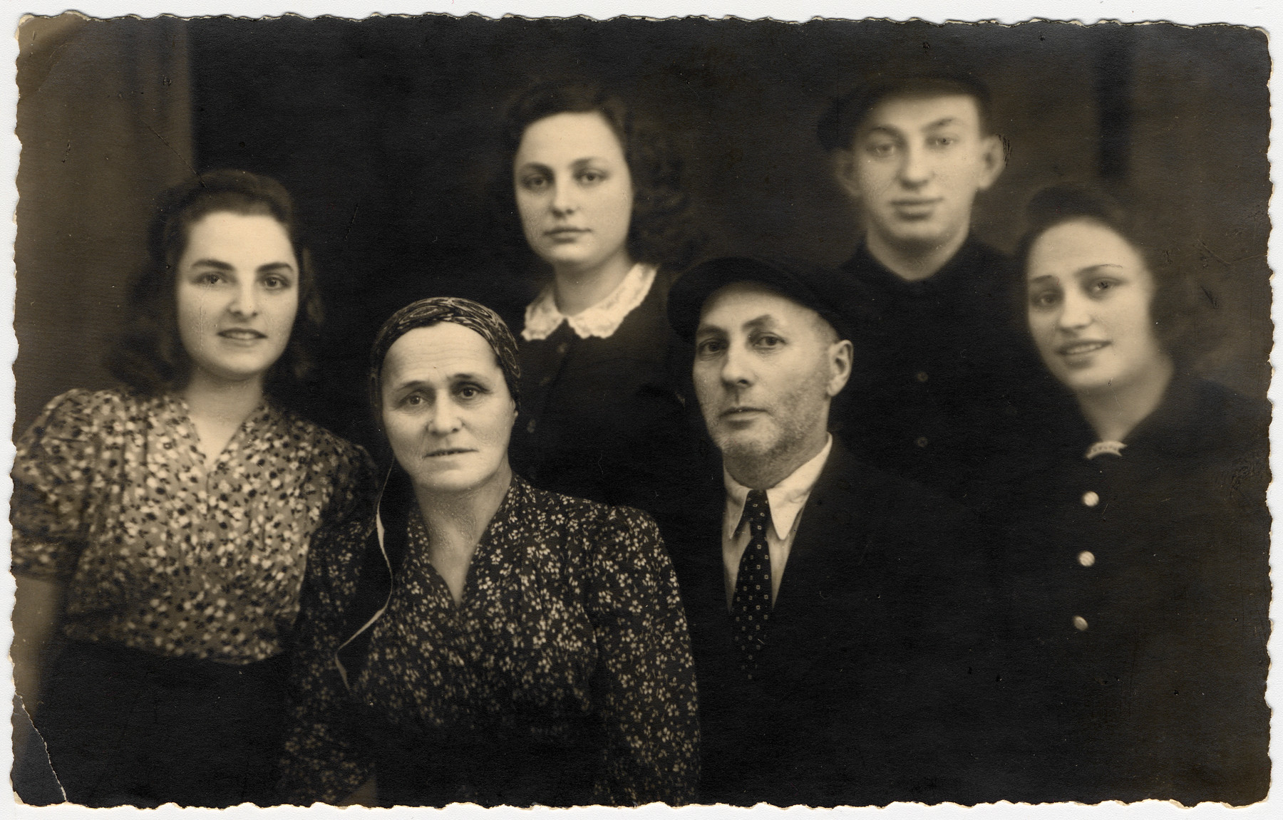 Postwar portrait of the Ass family who survived the war with the Bielski partisans.

From left to right are Chana Chamanovitch (their adoptive daughter), Beila, Itka, Yaakov Menachem, Yosef and Esther Ass.