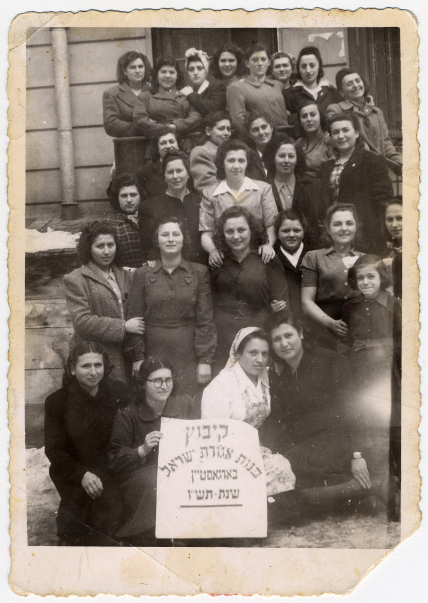 Group portrait of women from the religious Kibbutz Bnot Agudat Yisrael in Bad Gastein.

A shaliach (emissary) from Palestine is seated at the bottom right.