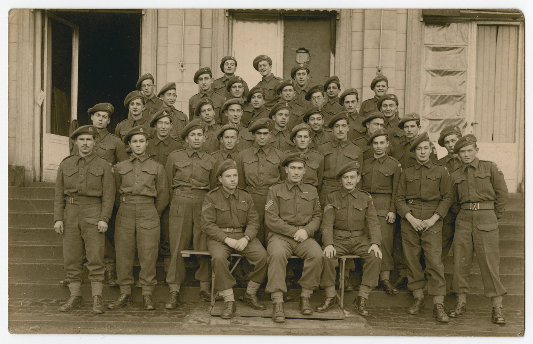 Group portrait of the members of the Third Battalion, Company A of the Jewish Brigade at their headquarters in Antwerp.

Among those pictured are Hersh Makowski, Eric Gross, Werner Szerevski and Zrubavel Horowitz.