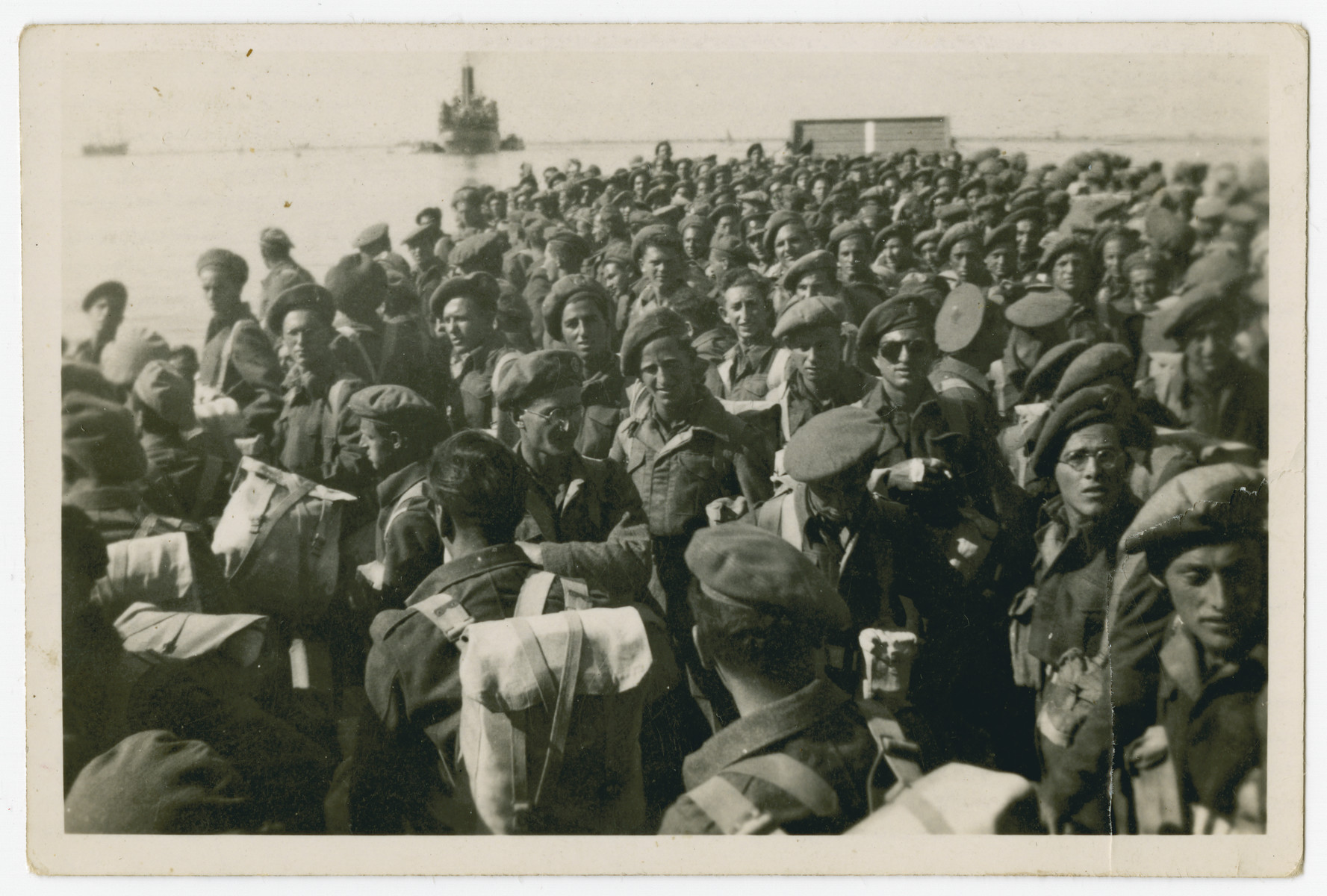 Jewish Brigade soldiers return to Palestine after the disbandment of the Brigade.

Hersh Makowski is pictured on the right looking at the camera.