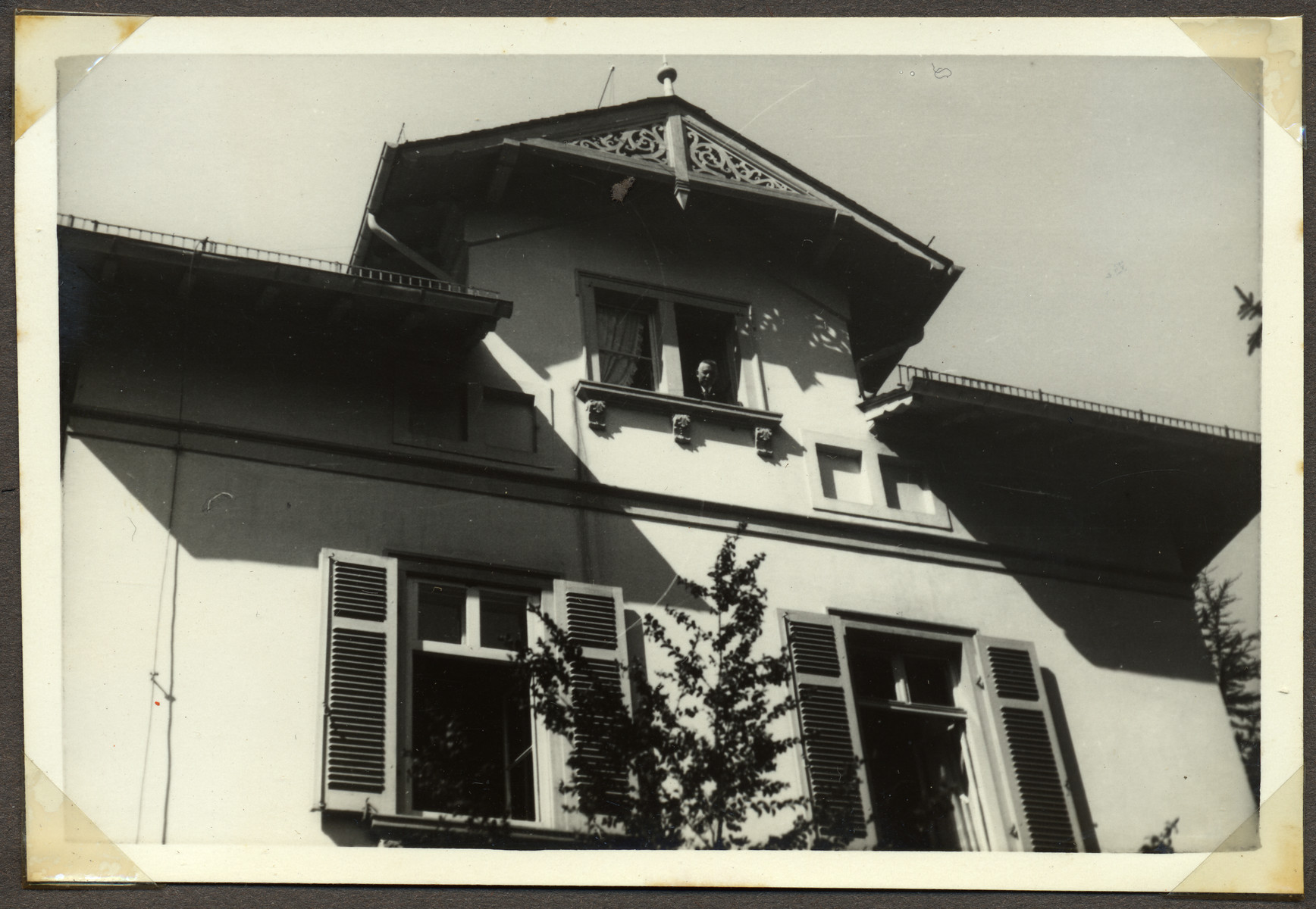 Hans Ehrenfeld looks out the top window of his home at Stettenstrasse 4, in Frankfurt.