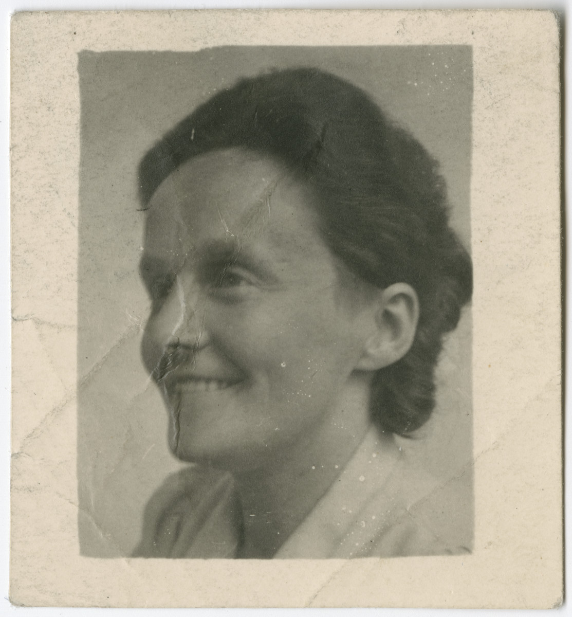 Portrait of Anne Onderweegs used on her false ID card. 

Anne and Dick Onderweegs were members of the resistance in the Netherlands, where they assisted Jews in hiding. These IDs were created to help them escape detection after they were denounced and sought for arrest. The Onderweegs resuced Louis de Groot.