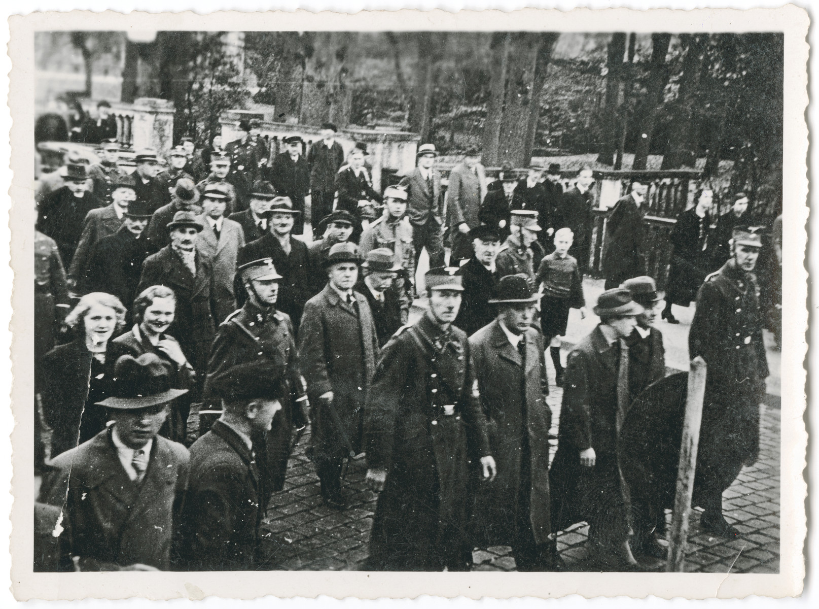 Members of the SA arrest Jewish men from Oldenburg and march them through the streets as bystanders look on.  Among those pictured is the great grandfather of the donor, Adolf Daniel de-Beer.

The orignal caption reads: "SA arrest and transport the Jews of Oldenburg to prison and concentration camp.  Part of a series of ten photographs."