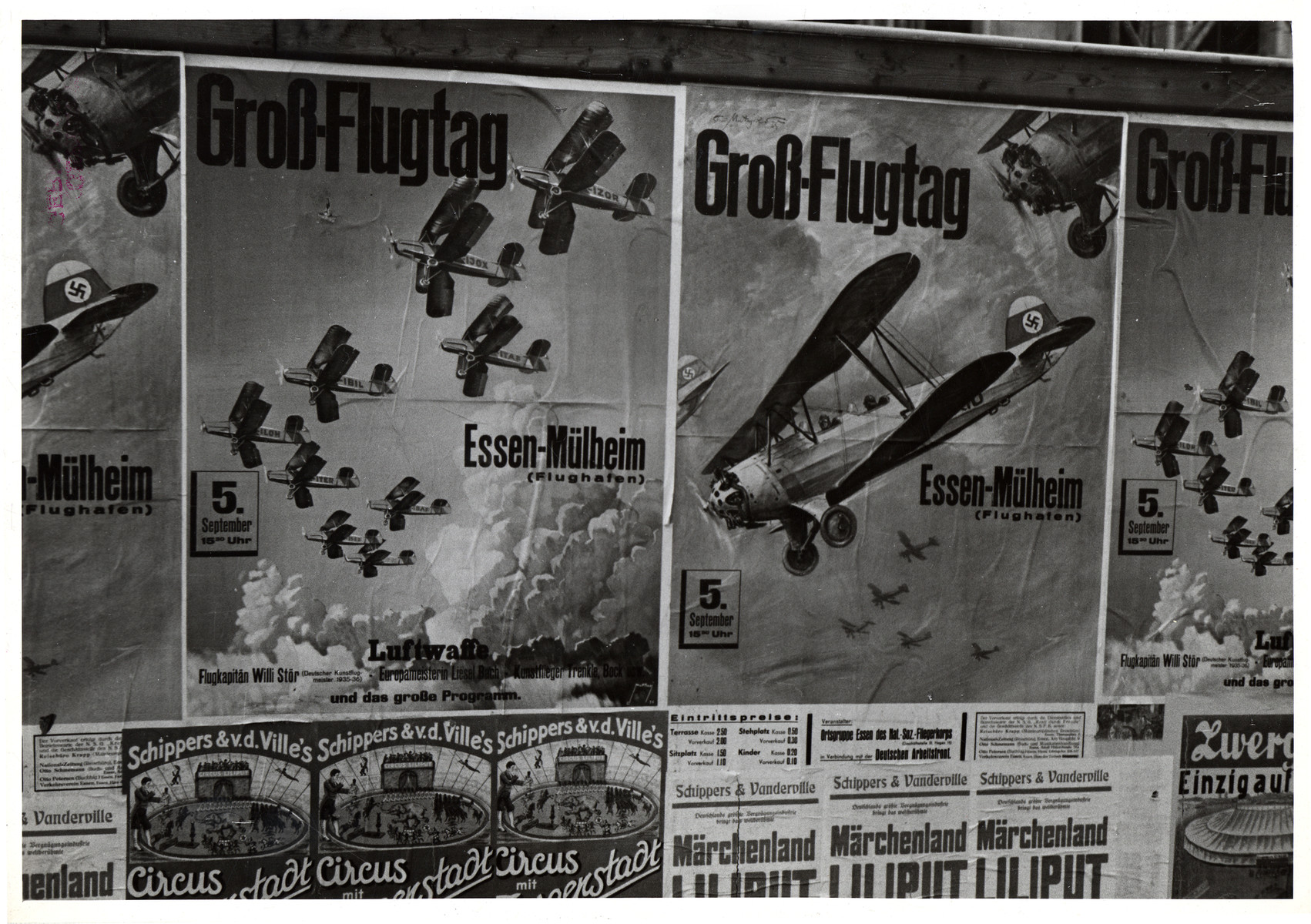 View of a bulletin board with posters advertising a major Luftwaffe air show.