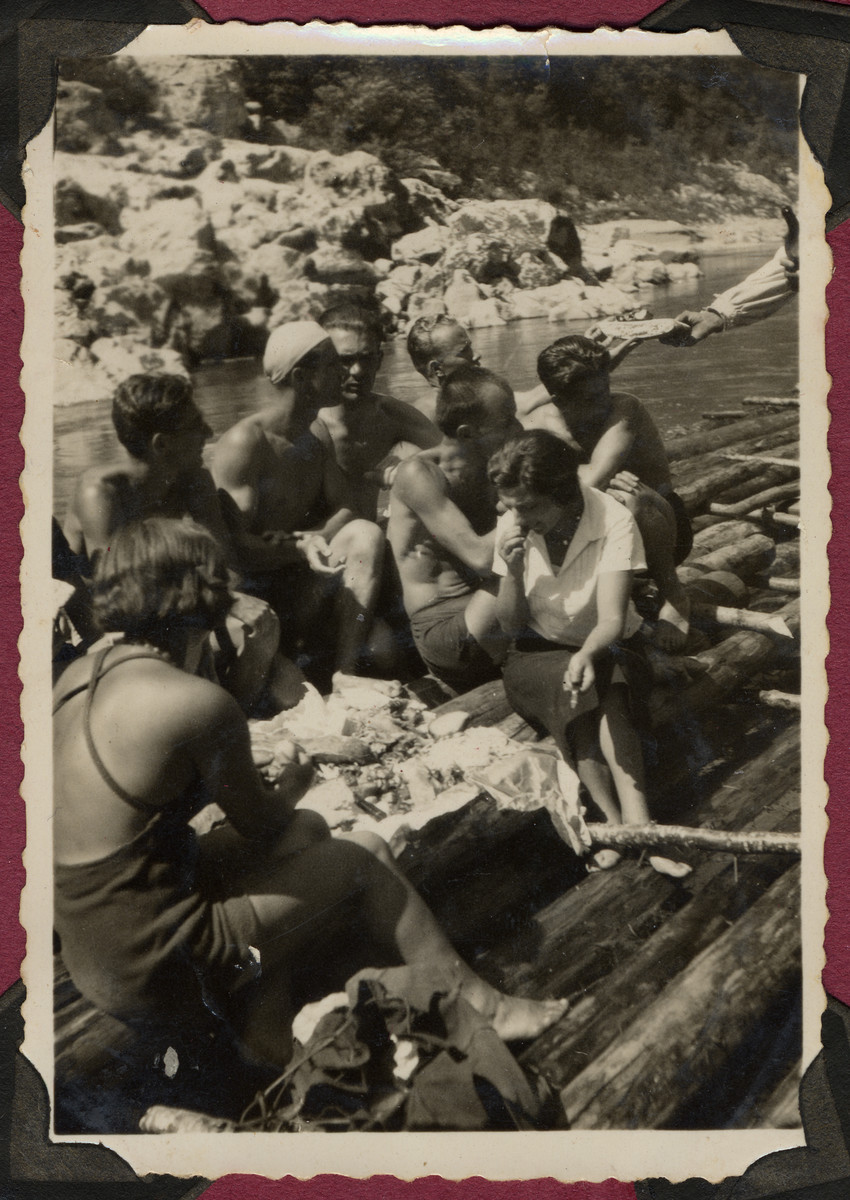 Young people picnic during an excursion on the Drina River.