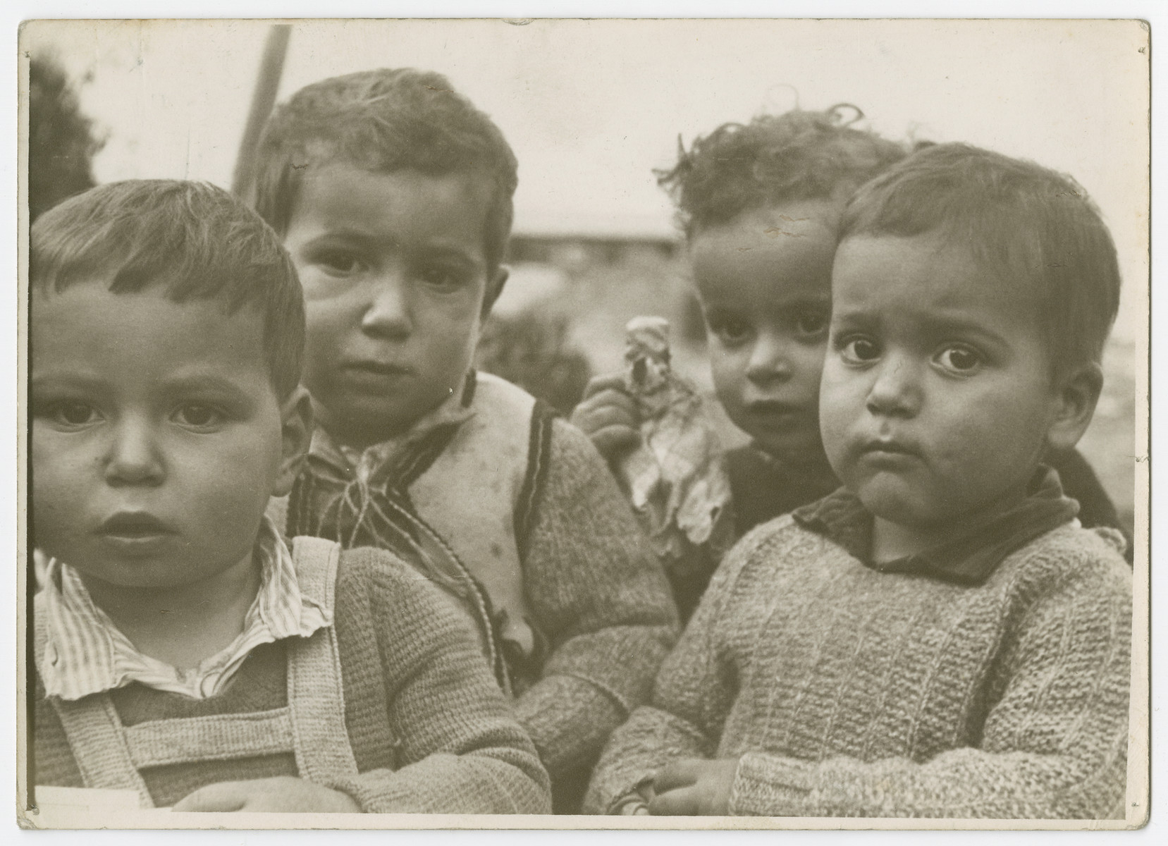 Close-up portrait of four young children.

Photograph is used on page 244 of Robert Gessner's "Some of My Best Friends are Jews."