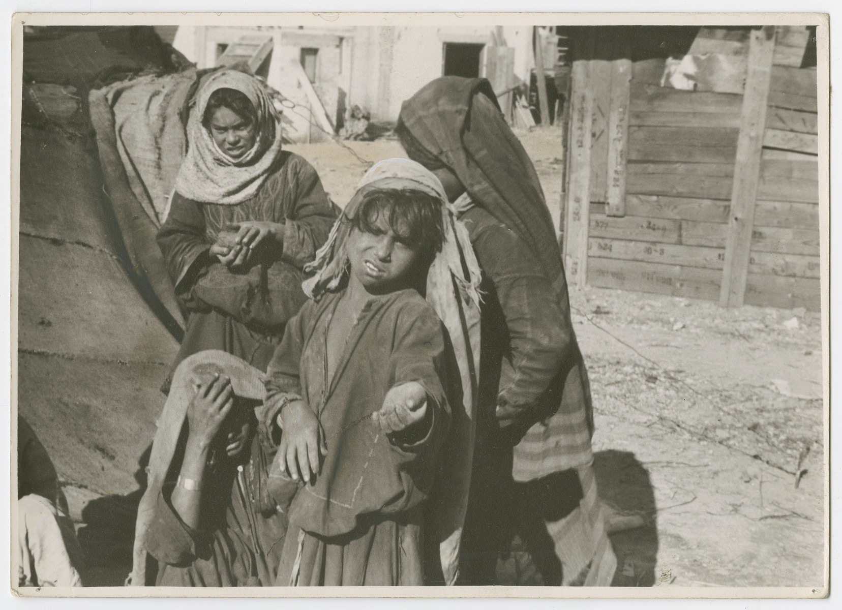 Children [probably Arab] beg in an unidentified location in Palestiine.

Photograph is used on page 244 of Robert Gessner's "Some of My Best Friends are Jews."