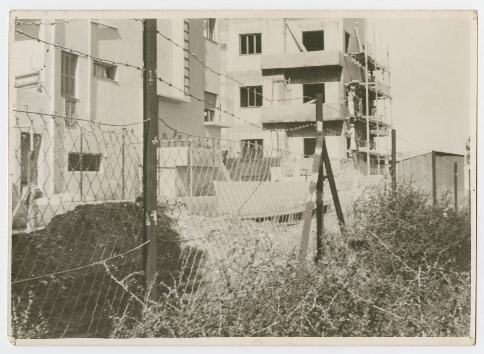 View of an apartment house in Sarona, which was created as a colony of German Knight Templars in 1871. 

Photograph is used on page 188 of Robert Gessner's "Some of My Best Friends are Jews." The pencil inscription on the back of the photograph reads, "Nazi protector?  Ag Jews."
