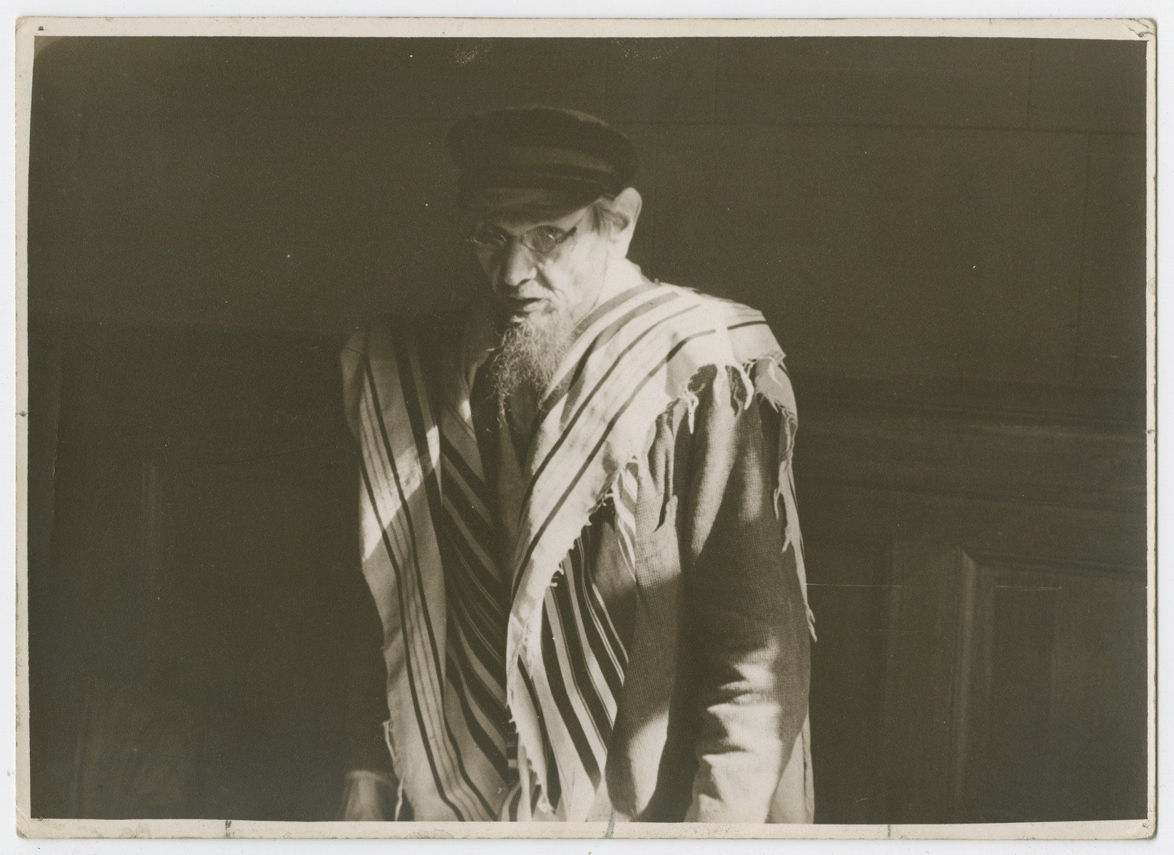 Portrait of a Jewish man wrapped in a tallit at the Great Synagogue in Moscow on Rosh Hashanah.

Photograph is used on page 332 of Robert Gessner's "Some of My Best Friends are Jews."