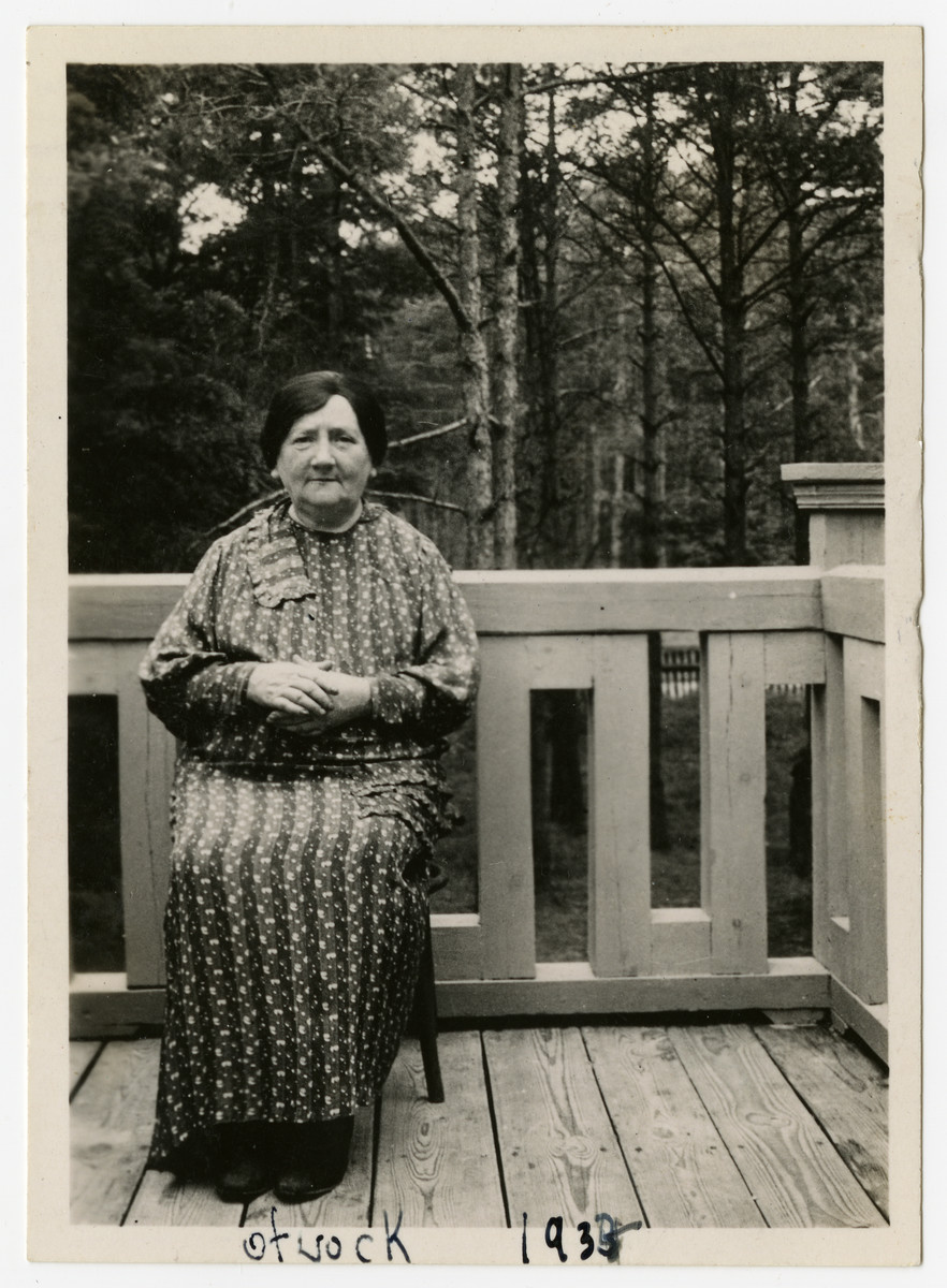 Miriam Rabinoowitz sits on a veranda.