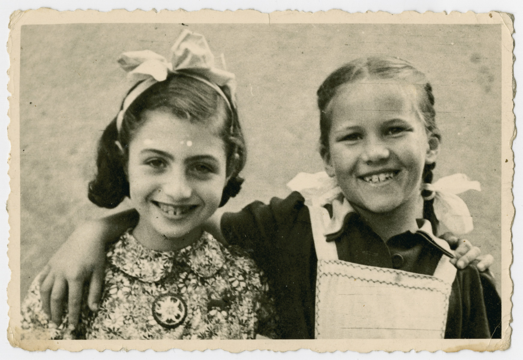 Eva Schonberg, a Jewish refugee child in Zurich, poses with her best friend Heidi.