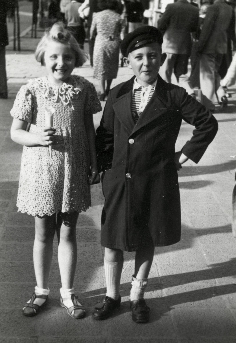 Reine Behar poses with her friend Boska Alvas on a street in Sofia.  She is wearing a dress that her mother made.