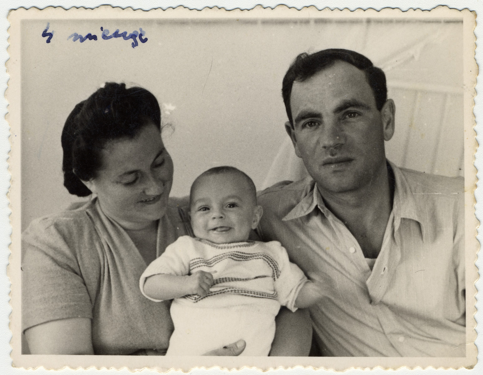 Studio portrait of Sonia and Zus Bielski and their four-month-old son, Yaakov.