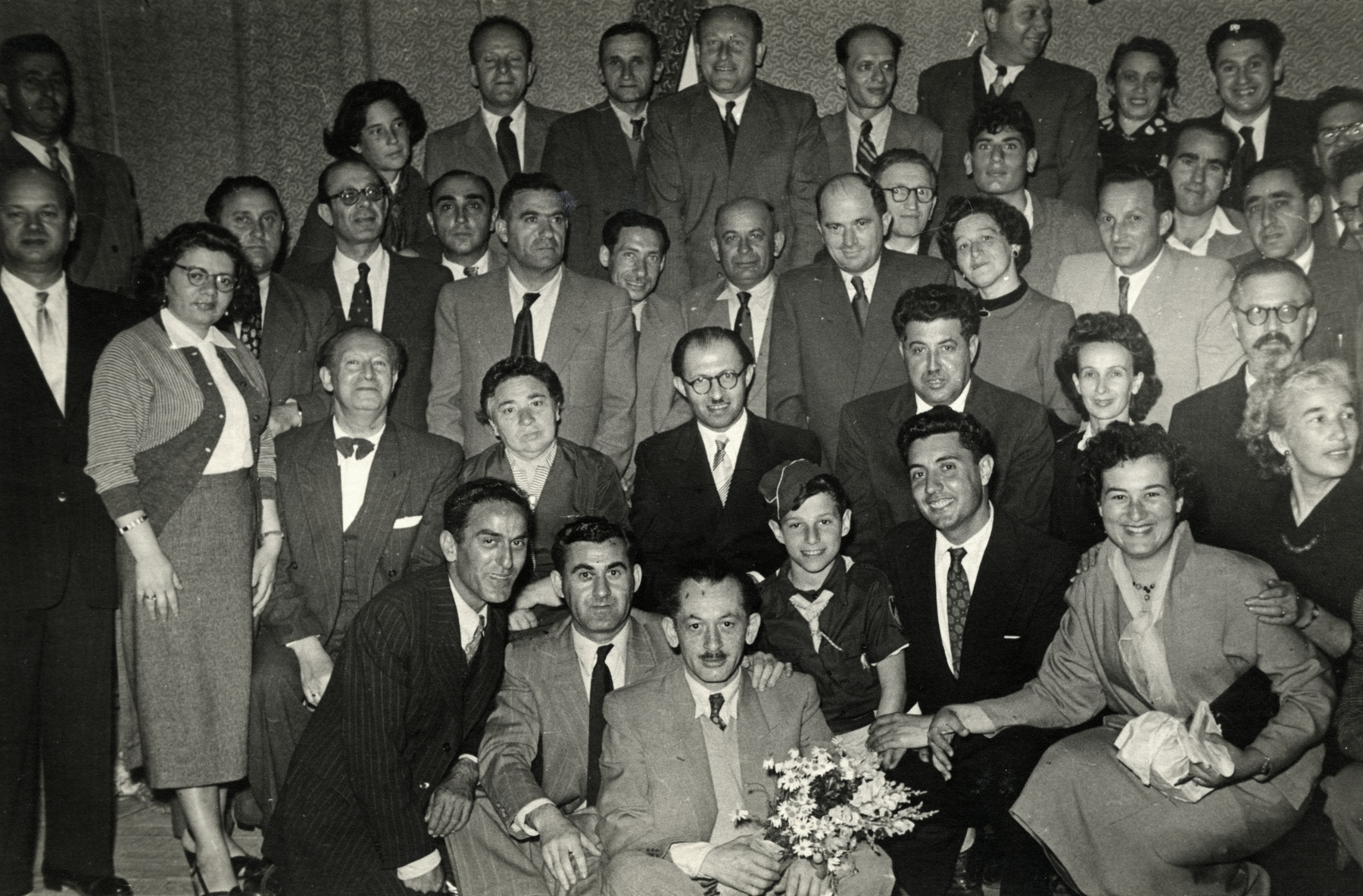 Meeting of members of the Herut  Party.

Menachem Begin is pictured in the center.  Raoul Tayar is in the second row, second from the right (diagonally below Begin.)