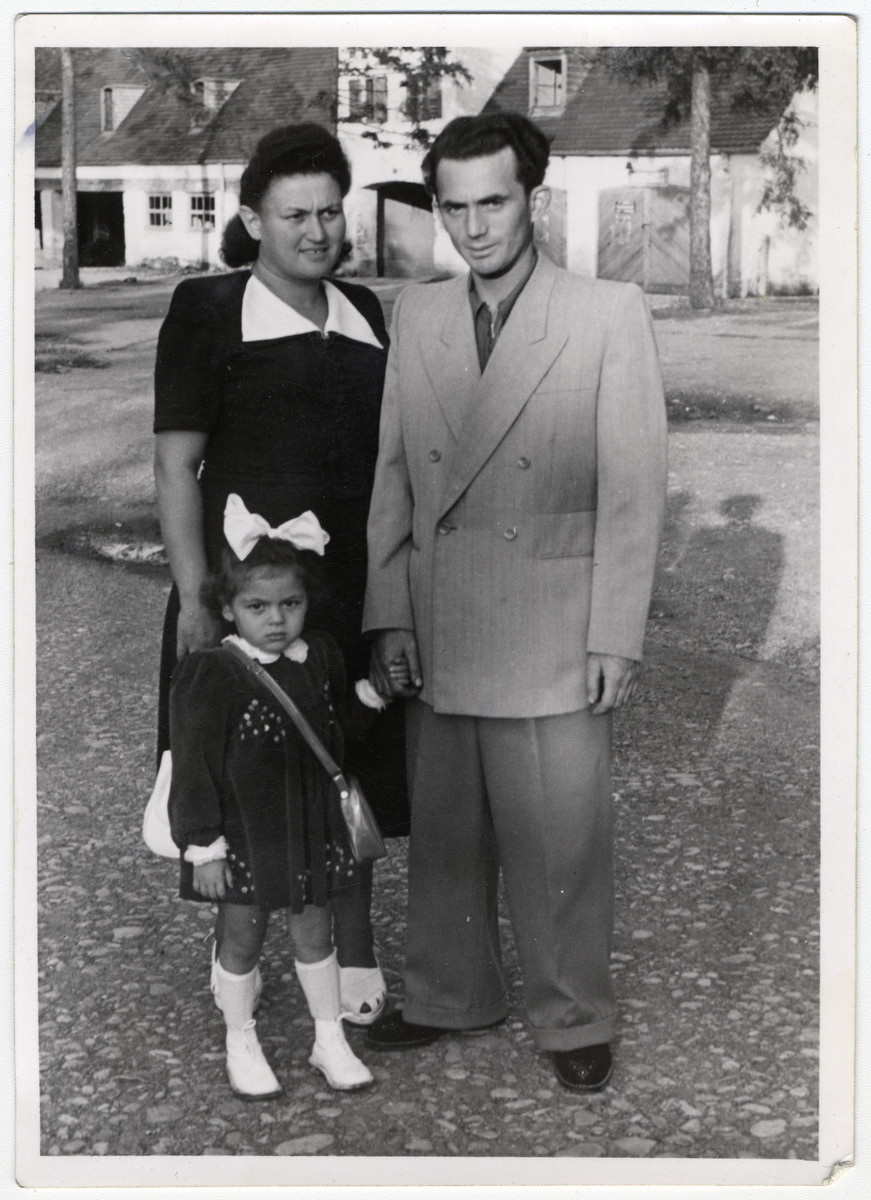 A Jewish family, probably in the Foehrenwald displaced persons camp.

Pictured are Pola and Sender Zawierucha with their daughter, Regina.