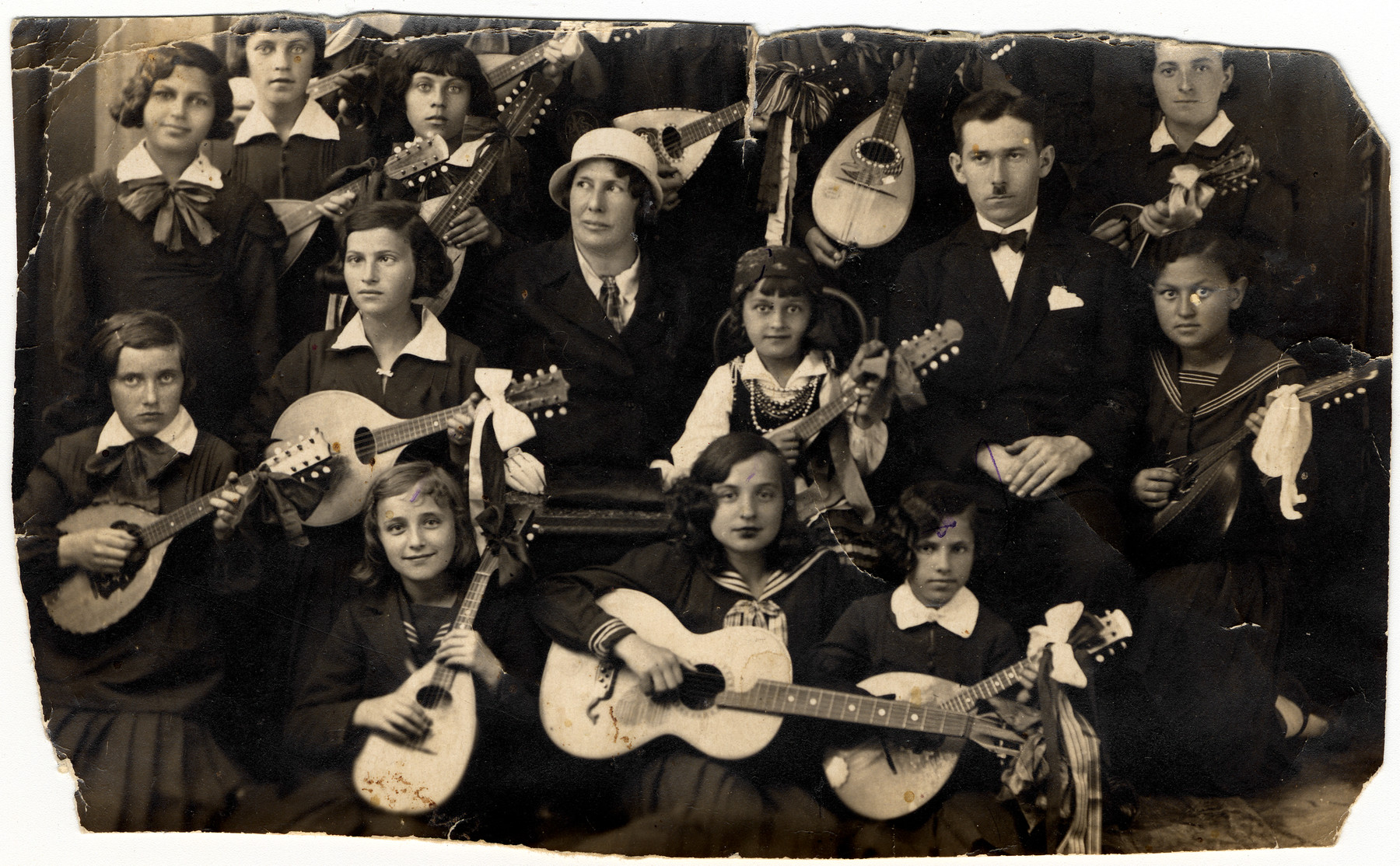 Group portrait of girls with mandolins and a guitar.

Among those pictured is Pola (Greiner) Zawierucha (middle row, far right).