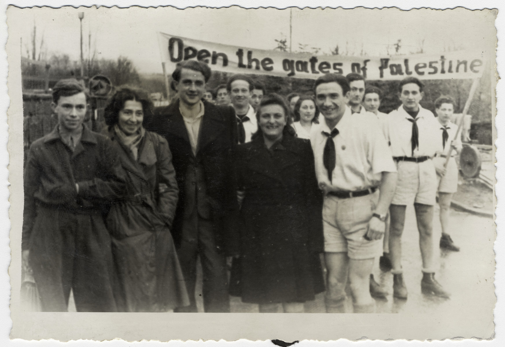 Members of Kibbutz Havivah Reik demonstrate against British Palestine immigration policy.

In the background is a banner that says, "Open the gates of Palestine."  Willy Bogler is standing in the center.
