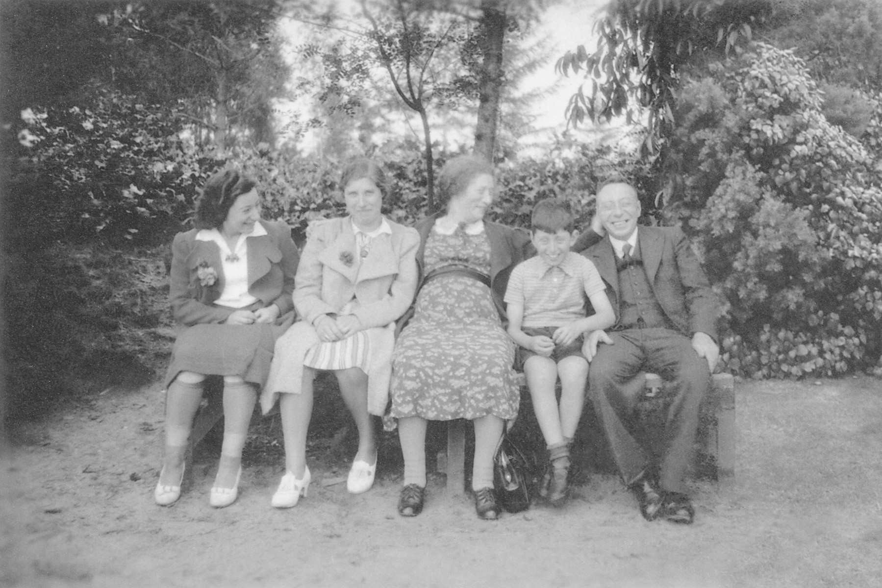 The Moses family poses on a park bench in prewar Netherlands.

Pictured from left to right are Lien Moses (Louis' half-sister), unknown, Froukje Moses, Louis Moses and Simon Moses.