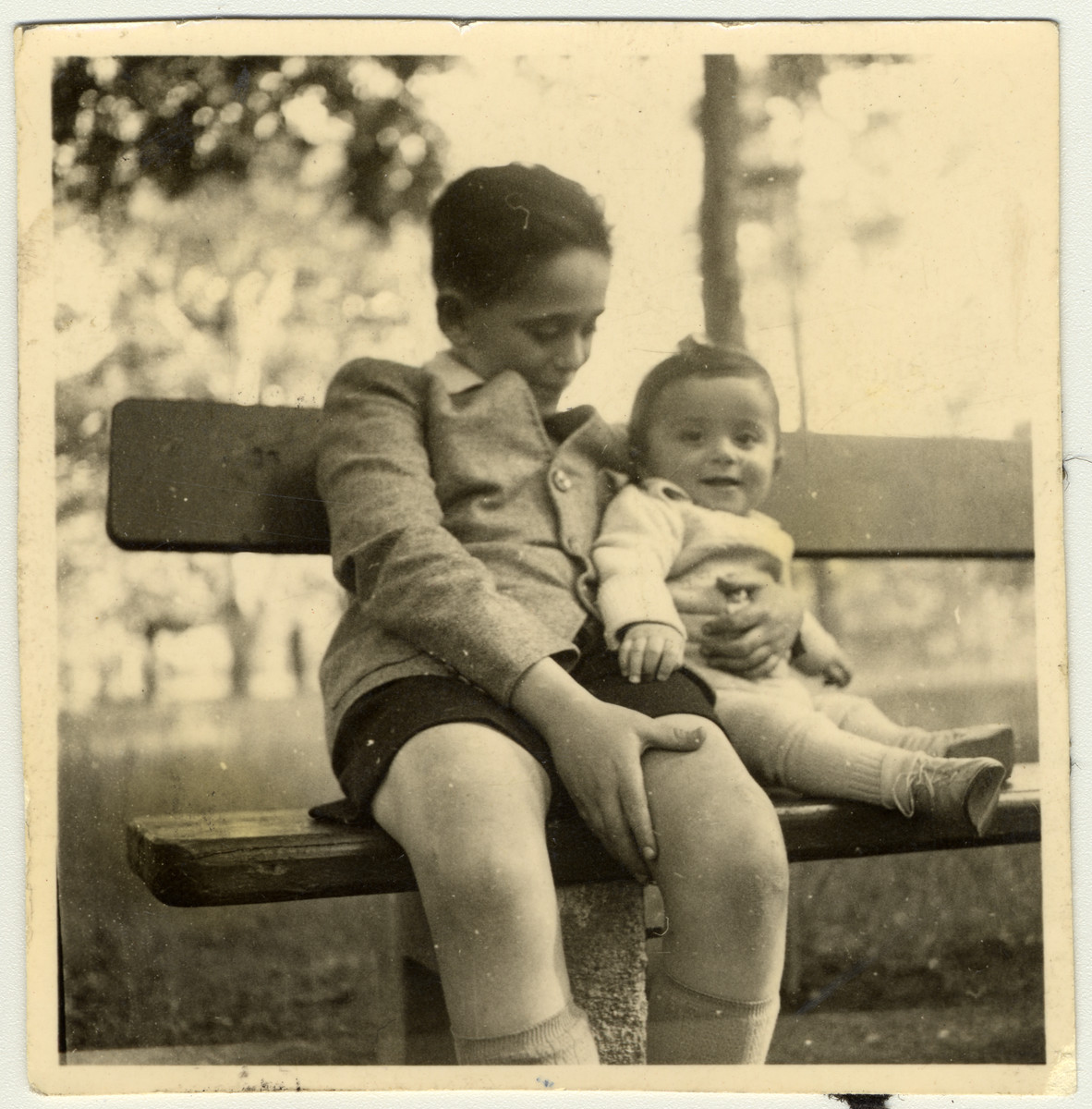 Janos Kovasc poses on a park bench with his half-brother, Istvan Reiner.
