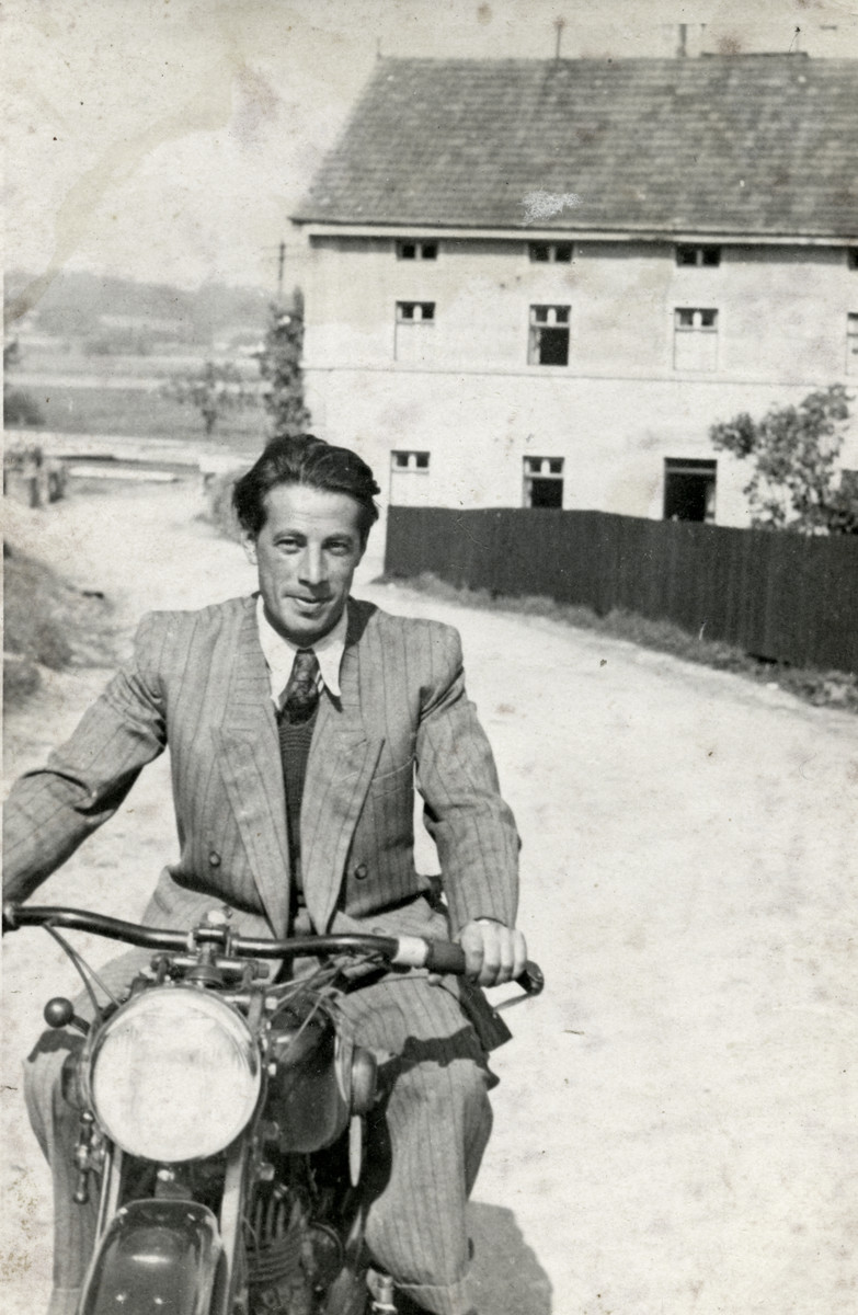 Zvi Herschel rides a  motorcycle in the Eggenfelden displaced persons camp.
