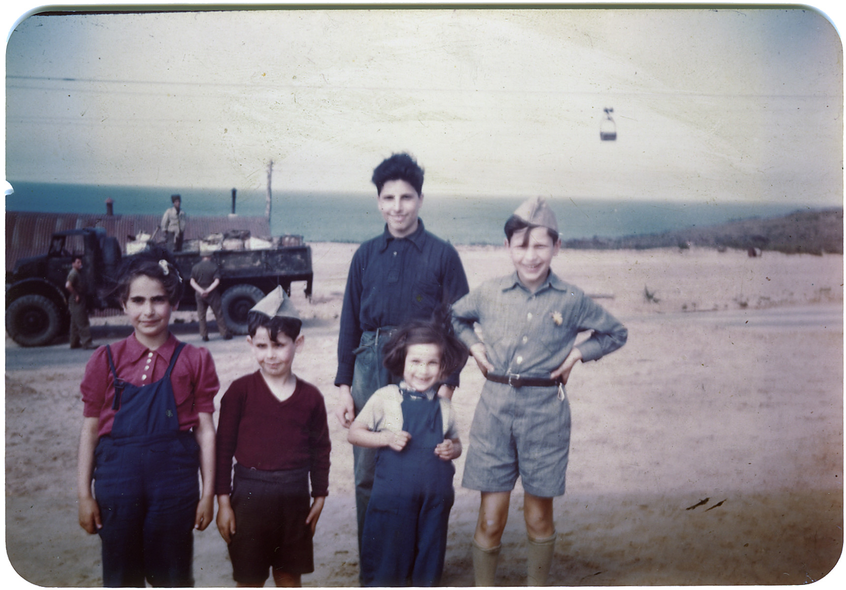Group portrait of Jewish children in the Jeanne d'Arc camp in Phillippeville who were sent their following their release from Bergen-Belsen in a prisoner exchange.

Hans Abraham is on the far right, and Ruth Abraham is in the front right.