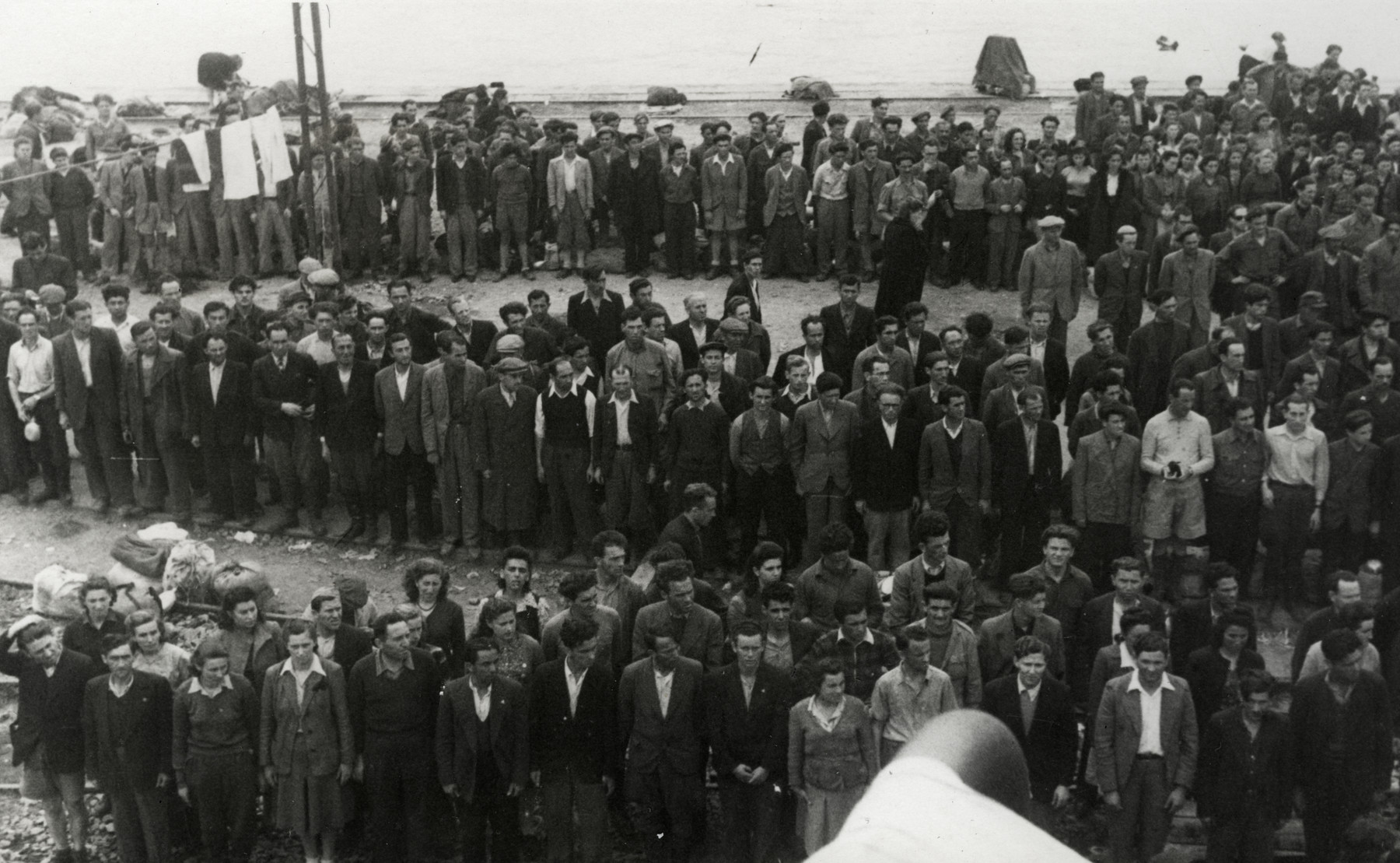 Jewish displaced persons gather at La Spezia harbor where they are conducting a hunger strike to garner support for their desire to immigrate to Palestine.