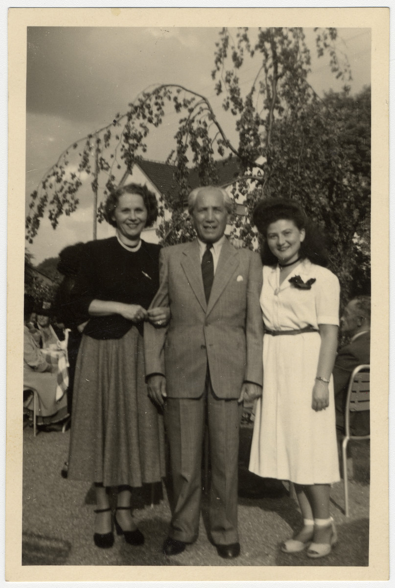 Cesia Honig poses with her aunt and uncle after liberation.

Cesia is pictured on the right.  Her Uncle Max (is in the center.  Max lived with Cesia and her family in Tarnow when he was a young man and was lbecame like an older brother to Cesia.