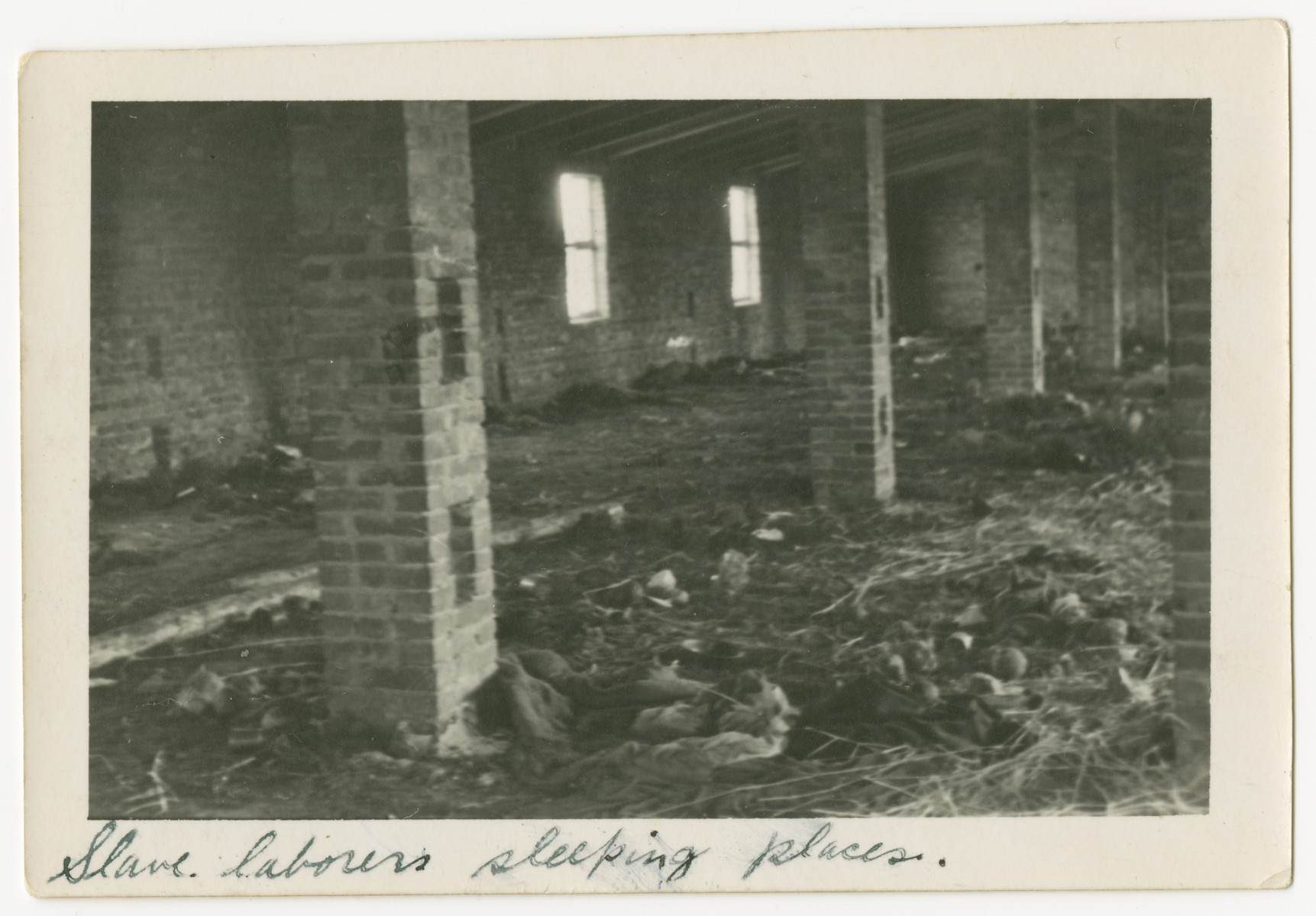An interior view of the sleeping quarters for the slave laborers at the Woebbelin concentration camp.

The photograph's original caption reads, "Slave laborers sleeping places."