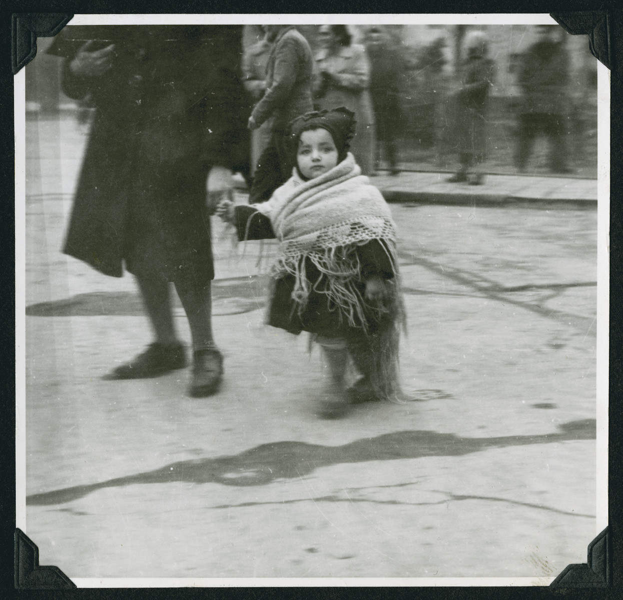 Close-up of a young child wrapped in a shawl in the Wetzlar displaced persons camp.