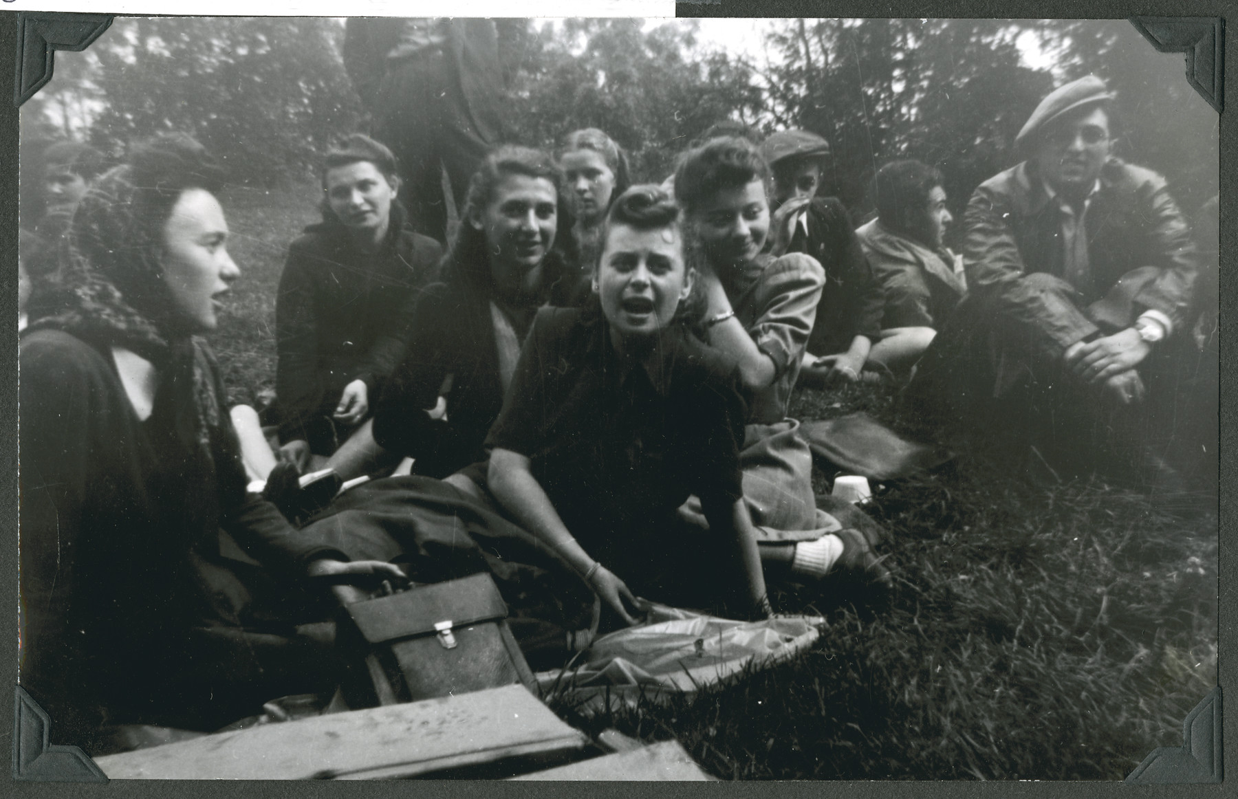 Teenage girls [probably from the Lindenfels children's home] enjoy an outing to Koenigstein Castle.

The original caption reads: "Picnic: Koenigstein Castle.  Songs and smiles brighten up the faces of the happy children."
