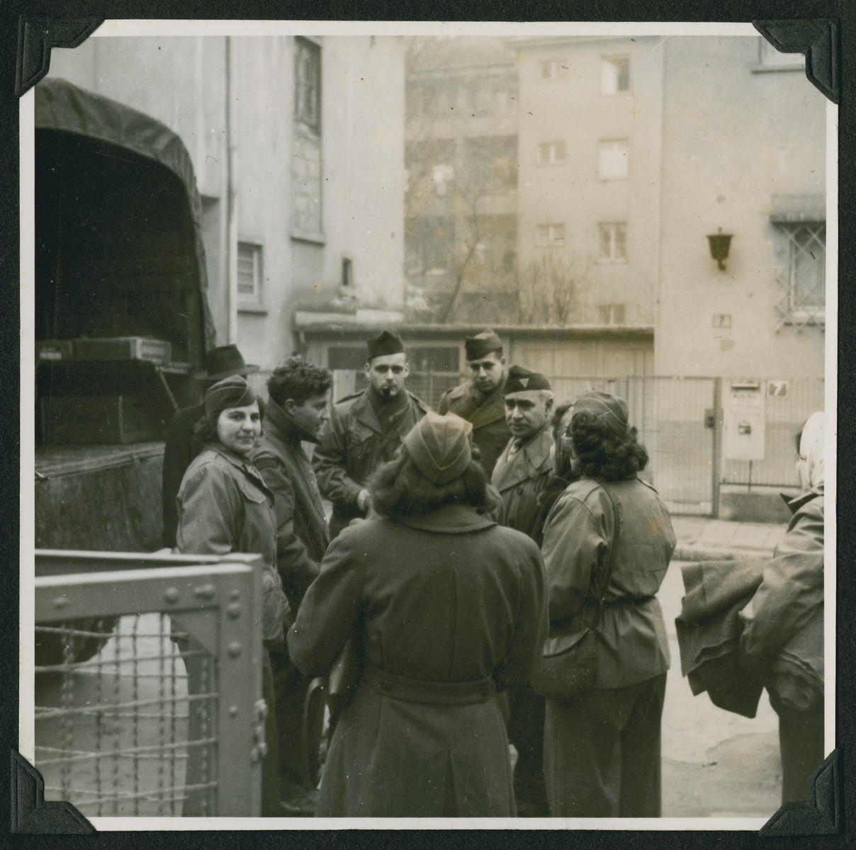 Members of the Frankfurt Jewish GI Council prepare to load supplies onto a truck to take to needy displaced persons in Babenhausen.

Maurice Levitt is standing in the center on the left facing the camera.  Yehuda Lev is second from the left.