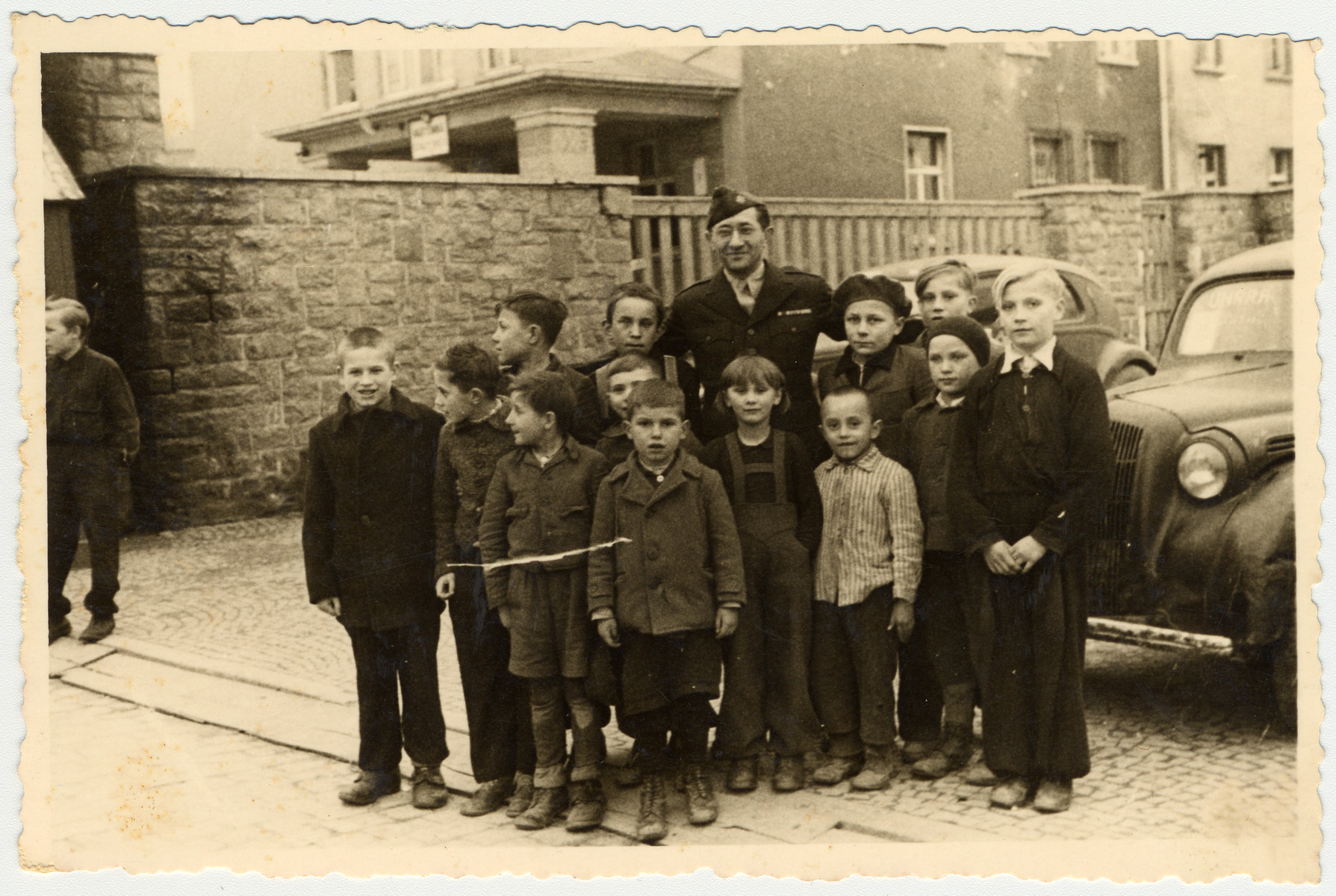 Mordecai Schwartz poses with a group of children in the Aschaffenburg displaced persons' camp.