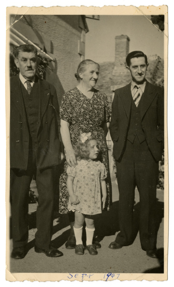 The Patoux family, the rescuers of Felice and Beate Zimmern, pose outside after the war.

Standing left to right are Gaston, Juliette and Roger Patoux.