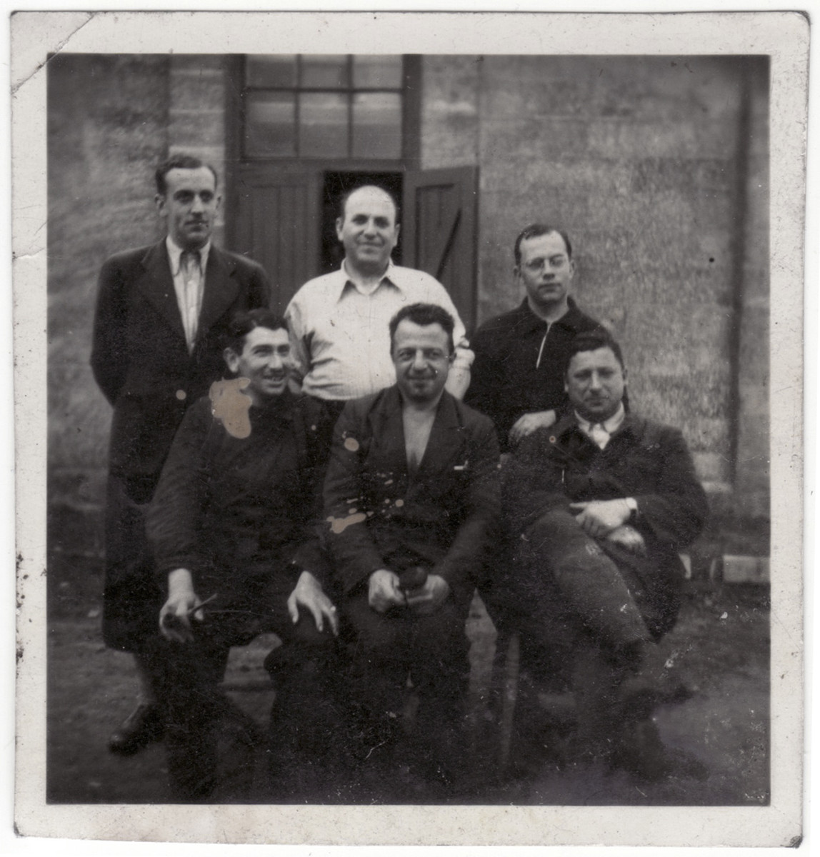 Group portrait of five Jewish men in the Kitchener refugee camp.