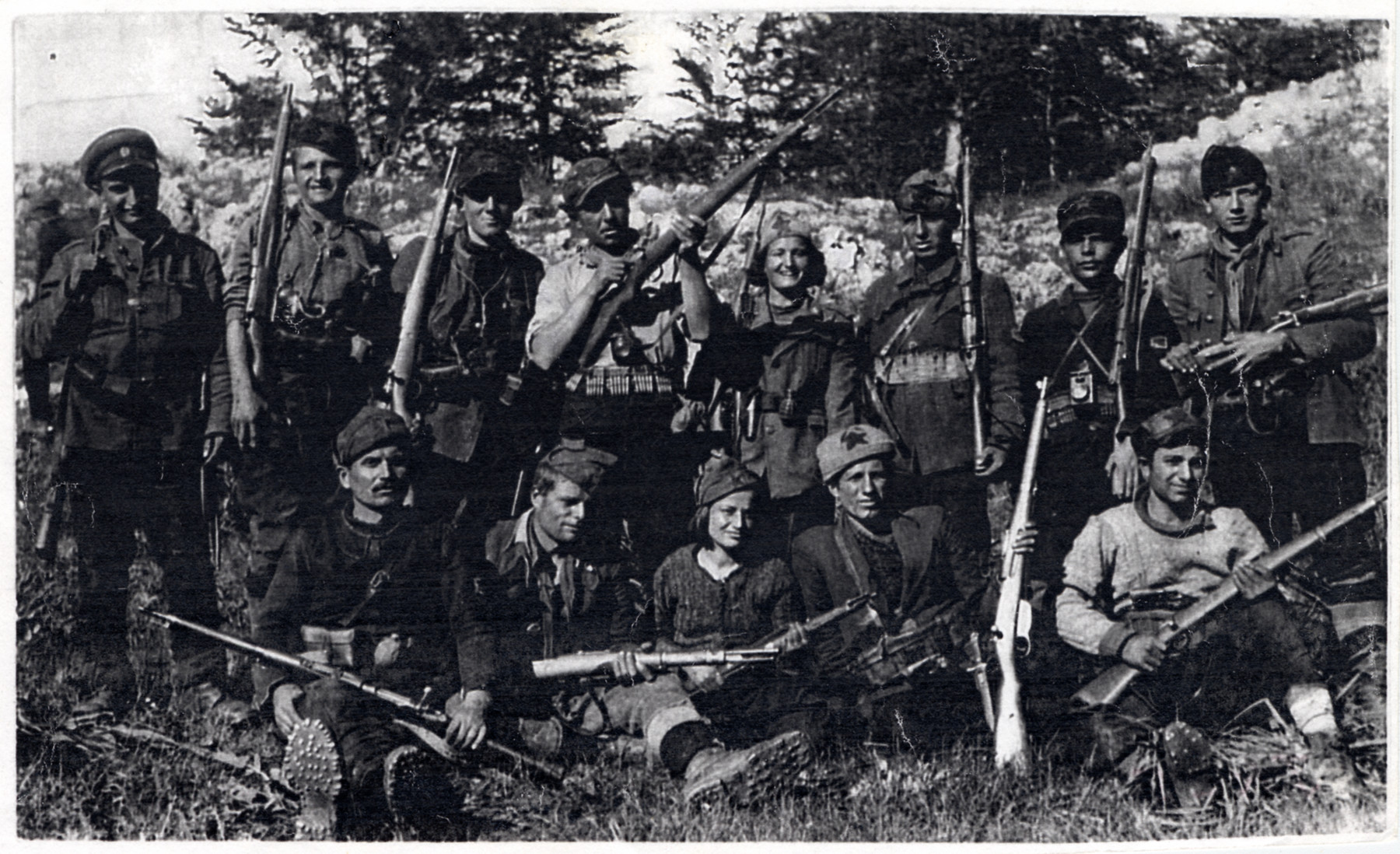 Macedonian partisans of the detachment "Damyan Gruev."  

Among those pictured are Jamila Kolonomos (back row, fourth from the left) and Adela Faradji (seated front row, center).