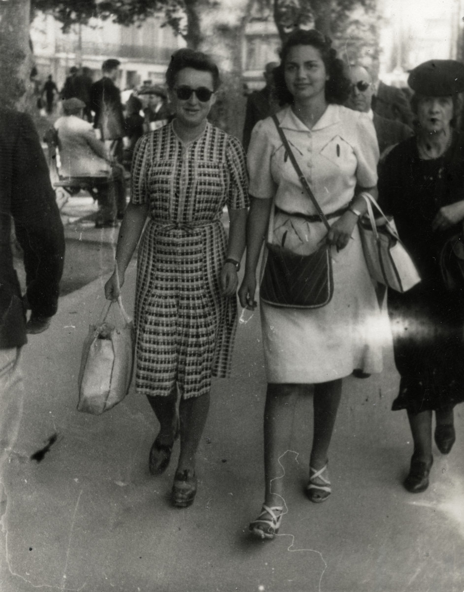 Denise Caraco and her friend Simone Lougassy walk on the Canebiere in Marseilles. Simone belonged to the Eclaireurs Israelites de France youth group.