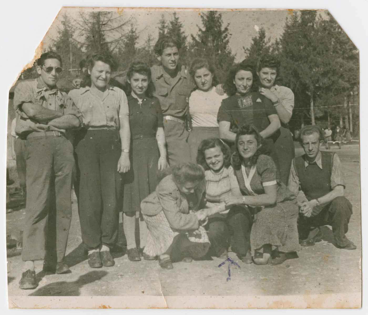 Group portrait of young people in the Feldafing displaced camp prior to their immigration to Israel.

Rachel Gutner is pictured in the center.