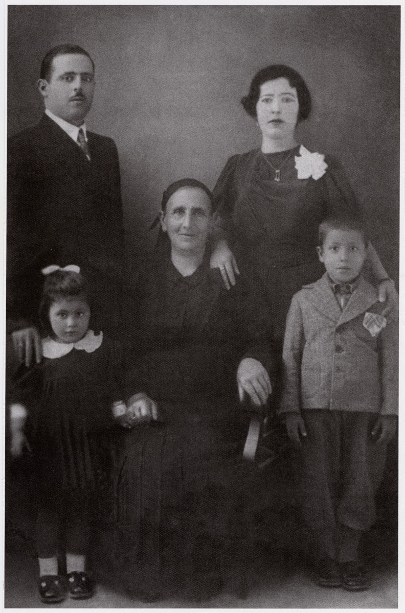 Prewar studio portrait of the Gabrielides family.

Pictured from left to right are Effie, Michael, Simha, Esther and Zino Gabrielides.