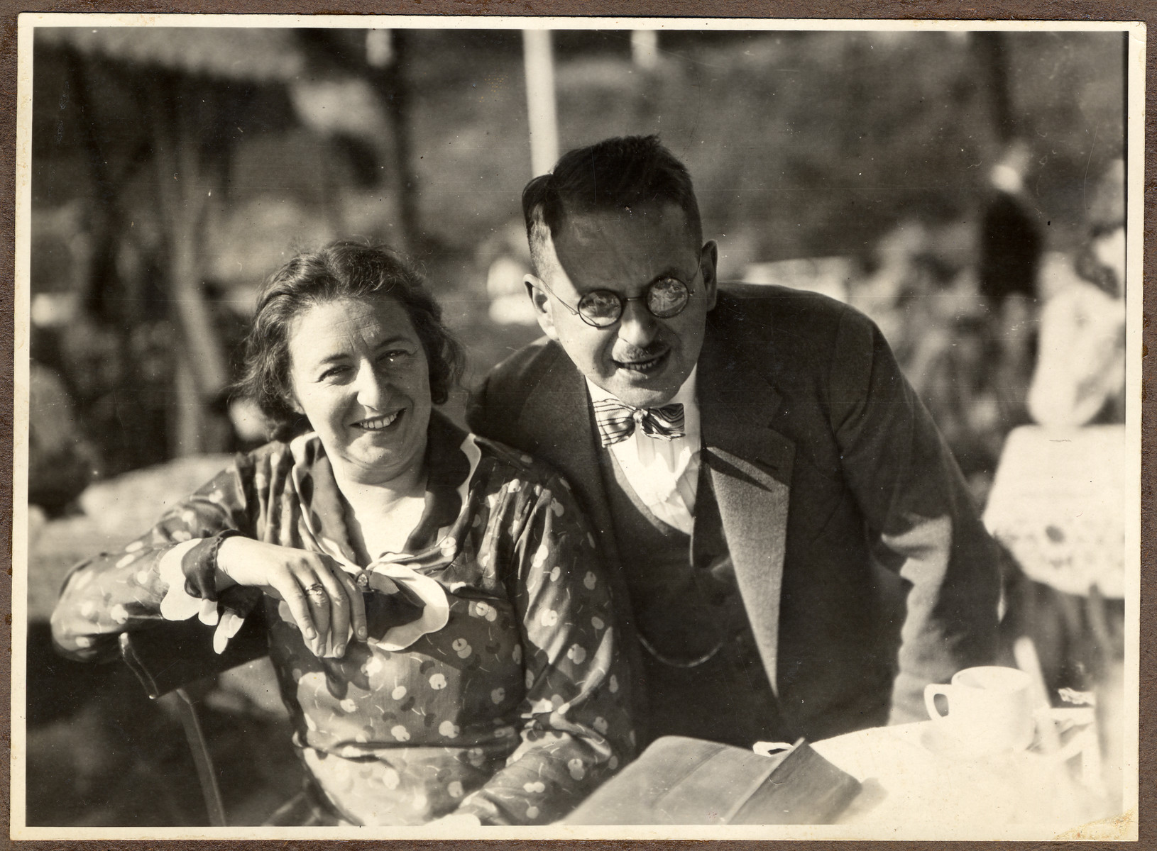 A German Jewish couple poses in an outdoor cafe.

Pictured are Dr. Hans Adolf and Augusta Bujakowksi.